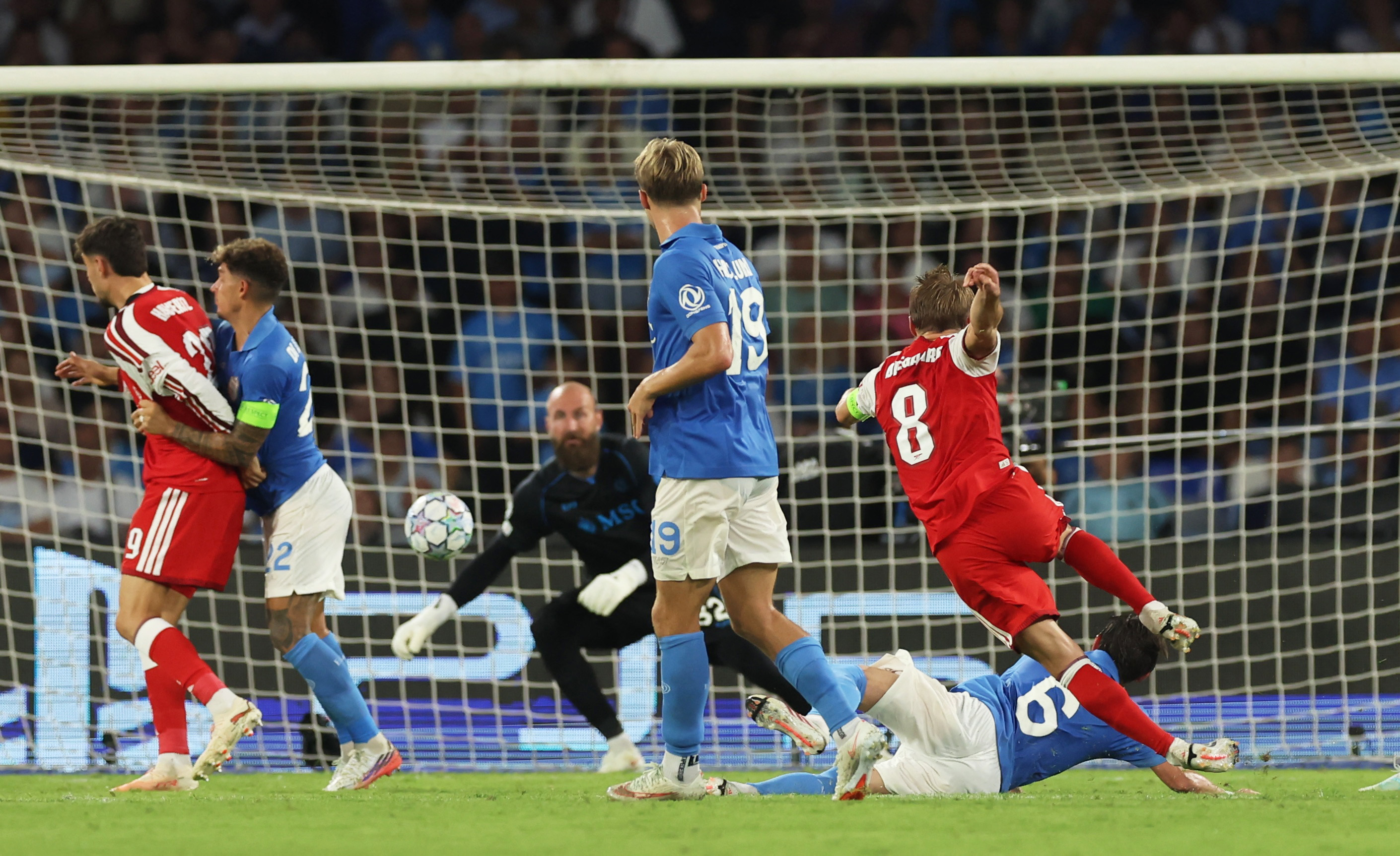 Arsenal's Martin Odegaard scores their first goal past Napoli's Vanja Milinkovic-Savic