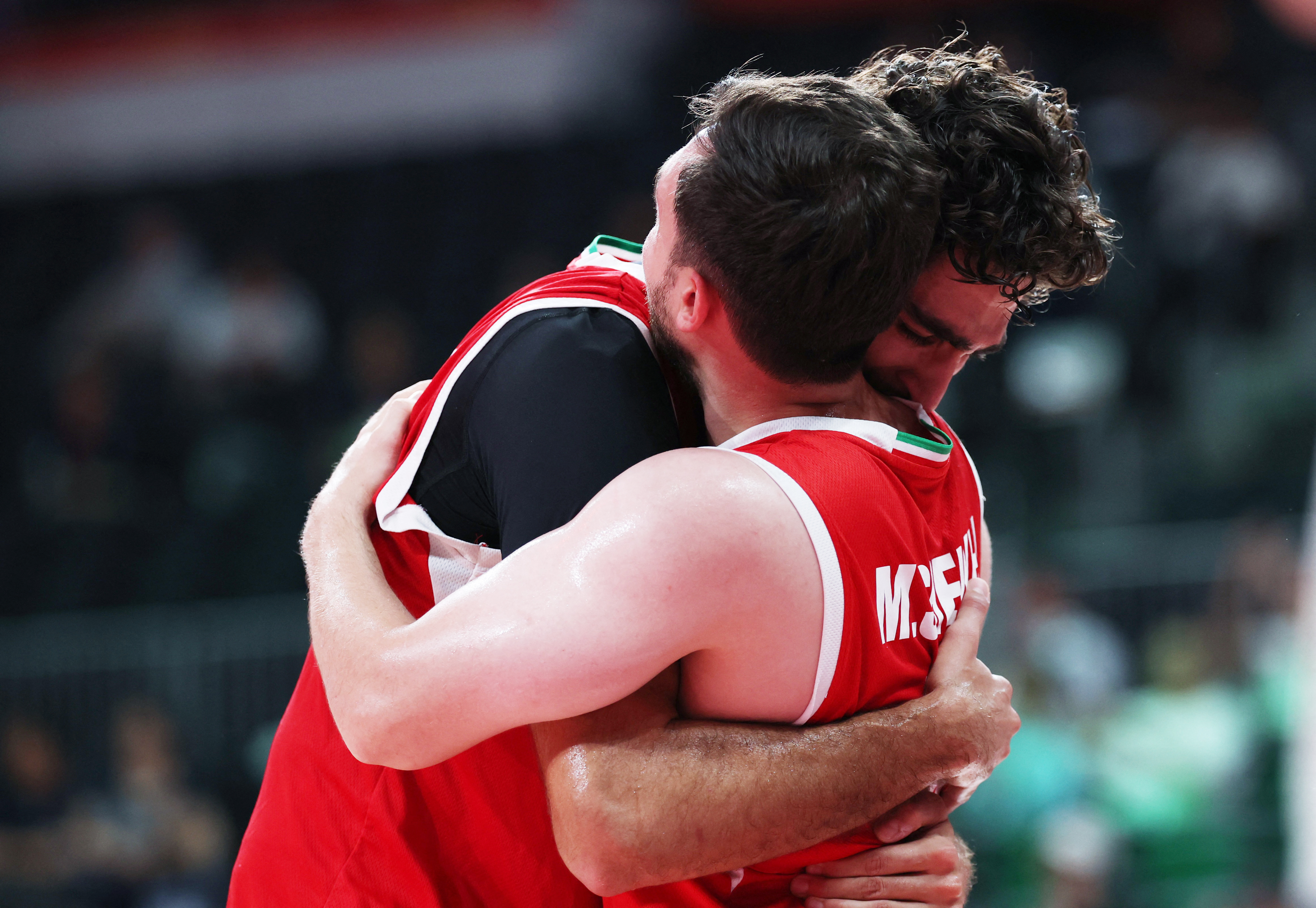 Asian Games – Aichi-Nagoya 2026 – Basketball – Men’s – Bronze Medal Match – China v Iran – Aichi International Arena, Nagoya, Japan – September 20, 2026 Iran’s Matin Aghajanpour and Mahdi Jafari celebrate after winning bronze in the Men’s Basketball REUTERS/Edgar Su