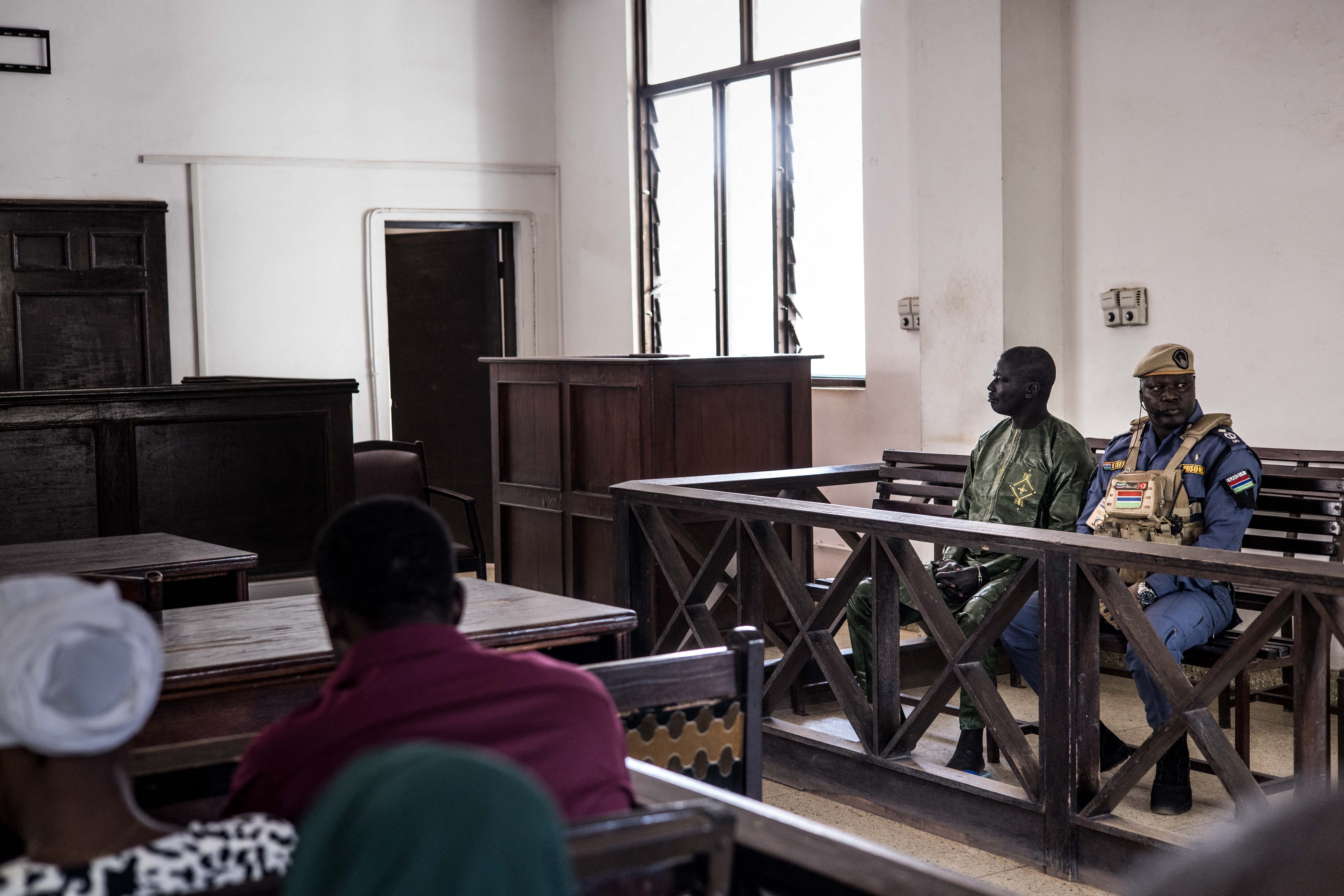 Sanna Manjang (2nd R), a former member of a Gambian death squad suspected of shooting AFP's correspondent Deyda Hydara in 2004, sits in the dock at the High Court in Banjul on January 15, 2025. [Muhamadou Bittaye/AFP]