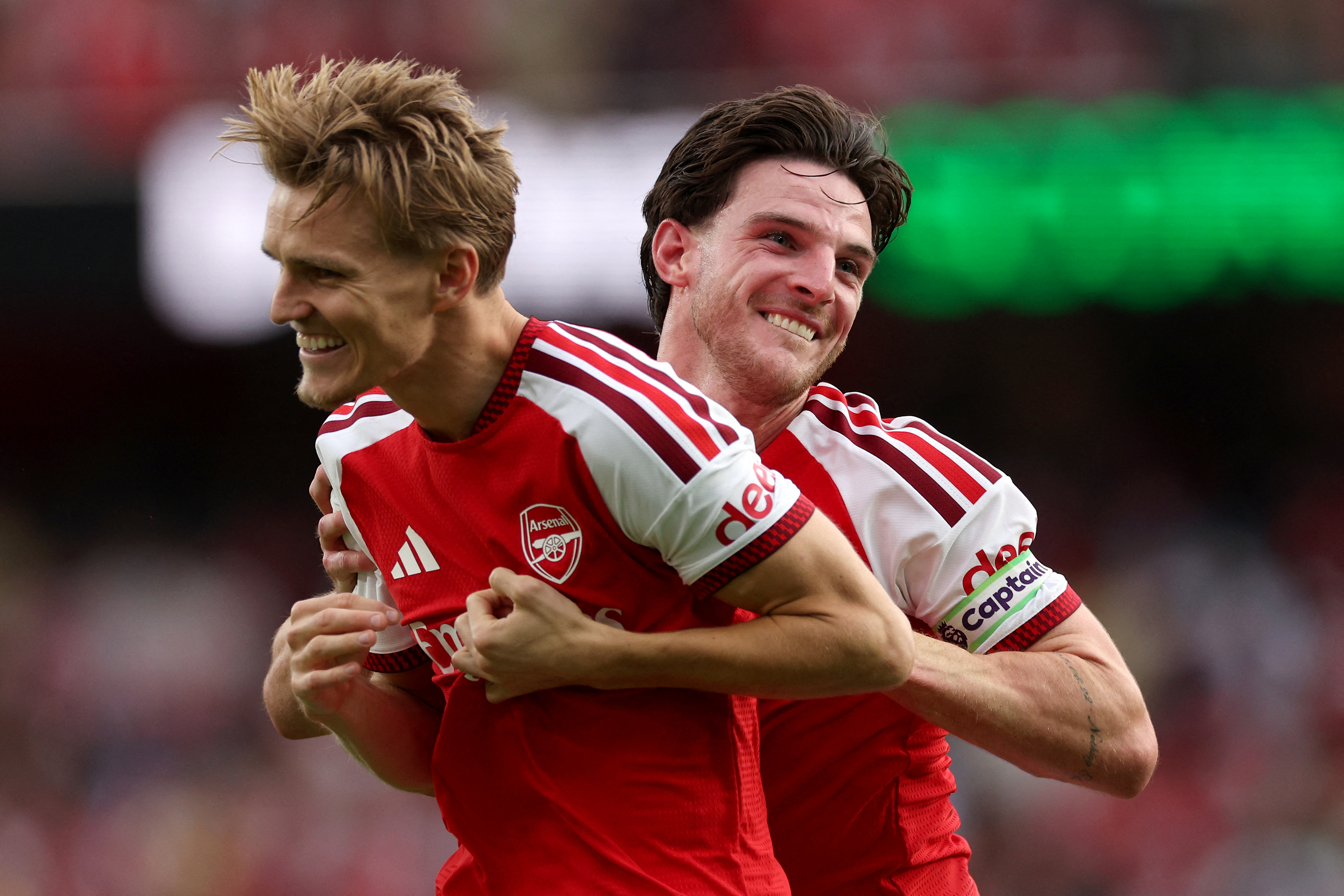 Arsenal's English midfielder #41 Declan Rice (R) and Arsenal's Norwegian midfielder #08 Martin Odegaard (L) celebrate after the English Premier League football match between Arsenal and Chelsea at the Emirates Stadium in London on September 6, 2026. (Photo by Adrian Dennis / AFP) / RESTRICTED TO EDITORIAL USE. No use with unauthorized audio, video, data, fixture lists, club/league logos or 'live' services. Online in-match use limited to 120 images. An additional 40 images may be used in extra time. No video emulation. Social media in-match use limited to 120 images. An additional 40 images may be used in extra time. No use in betting publications, games or single club/league/player publications. /