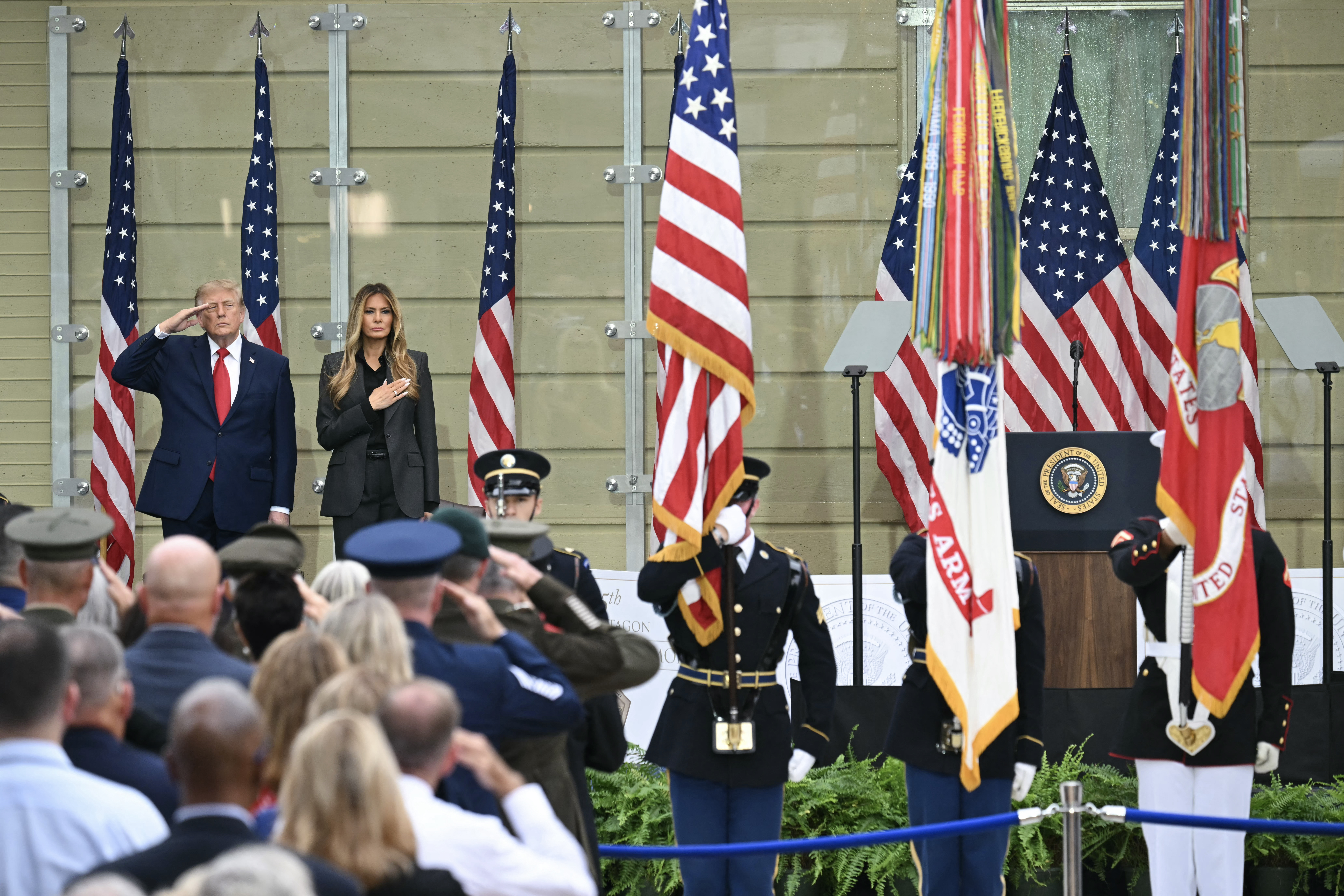 US President Donald Trump and US First Lady Melania Trump listen the national anthem during the 25th anniversary commemoration of the September 11, 2001 attacks at the Pentagon in Washington, DC, on September 11, 2026. (Photo by SAUL LOEB / AFP)