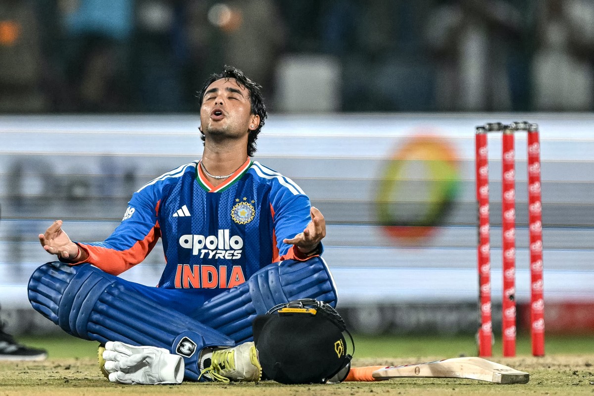 India's Abhishek Sharma celebrates after scoring a century (100 runs) during the third T20 international cricket match