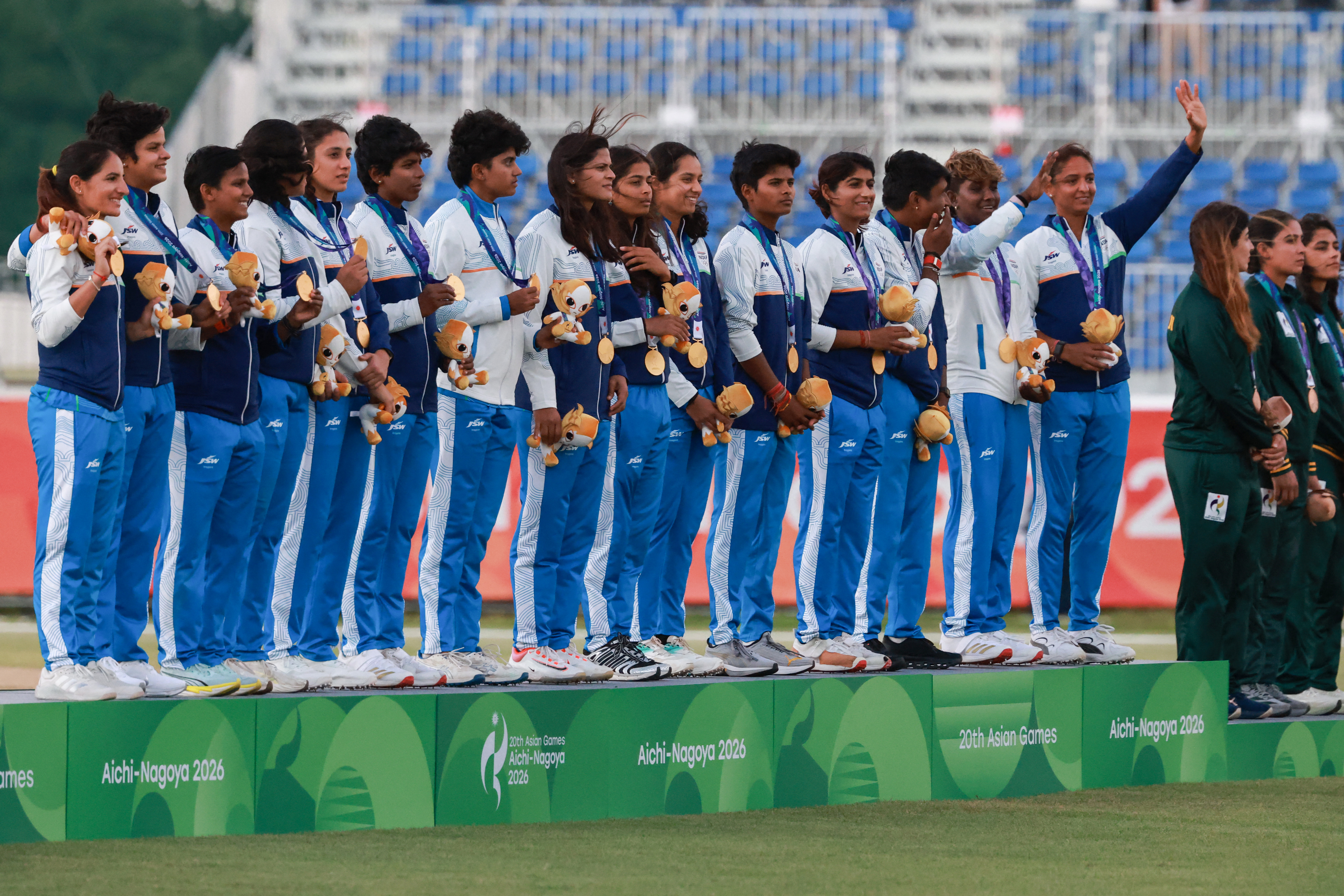 Gold medallists India stand on the podium.
