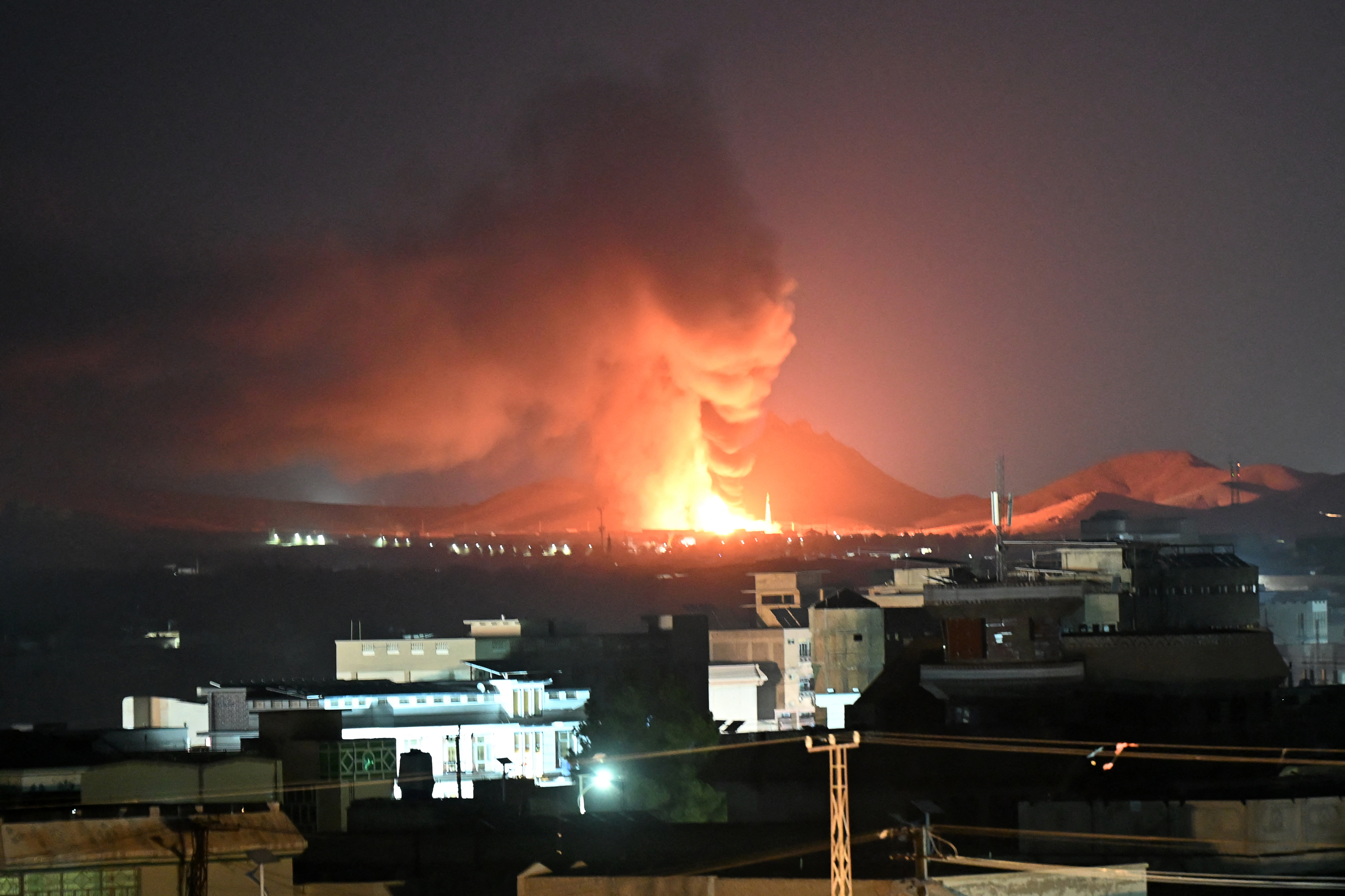 Flames and smoke rise from an area struck by an airstrike in Kandahar