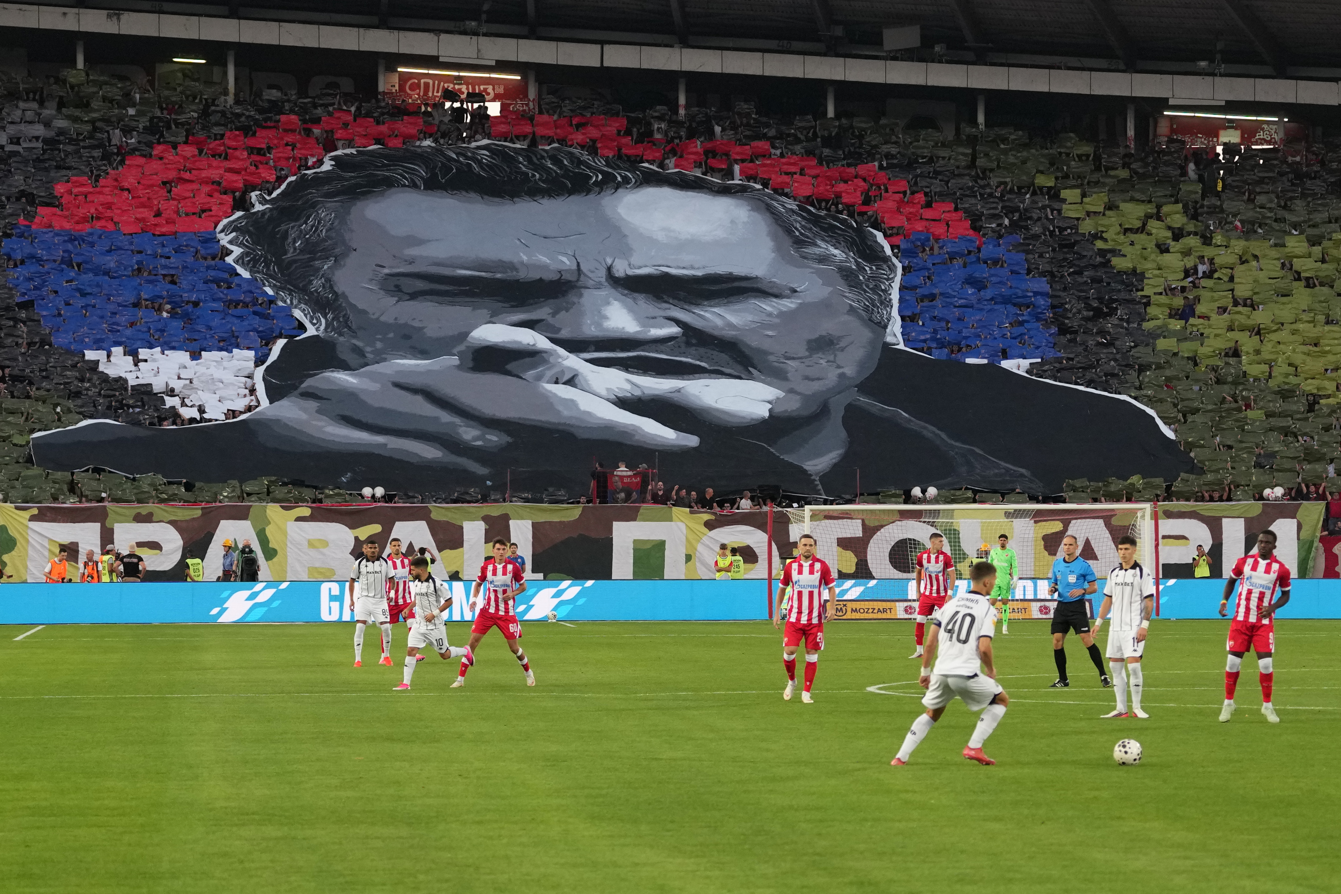 Red Star fans form an image of former Bosnian Serb wartime general Ratko Mladic during a Serbian National soccer league derby match between Red Star and Partizan in Belgrade, Serbia, Sunday, Sept. 6, 2026. (AP Photo/Darko Vojinovic)