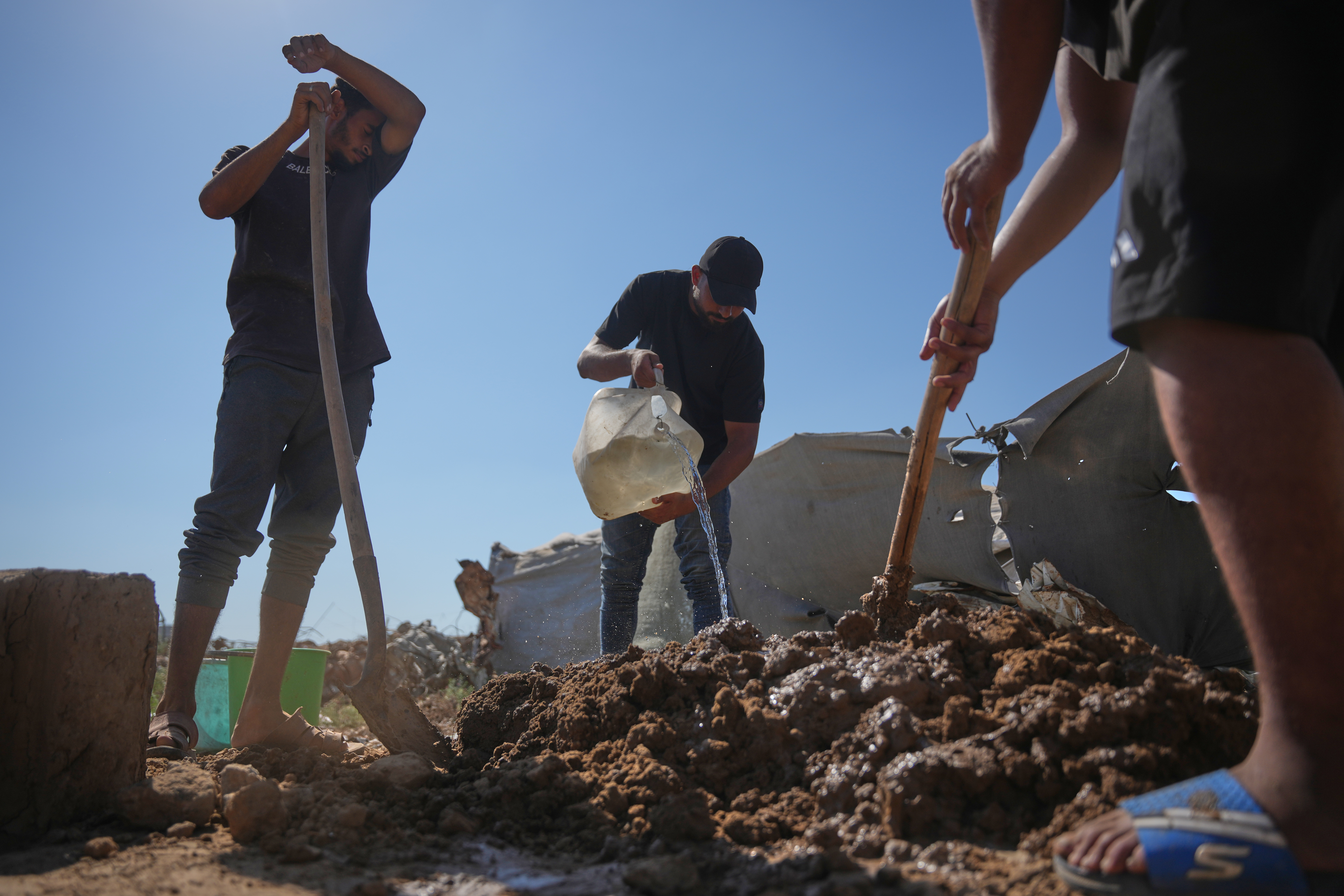 Palestinians rebuild Gaza’s ruins with mud bricks and scrap