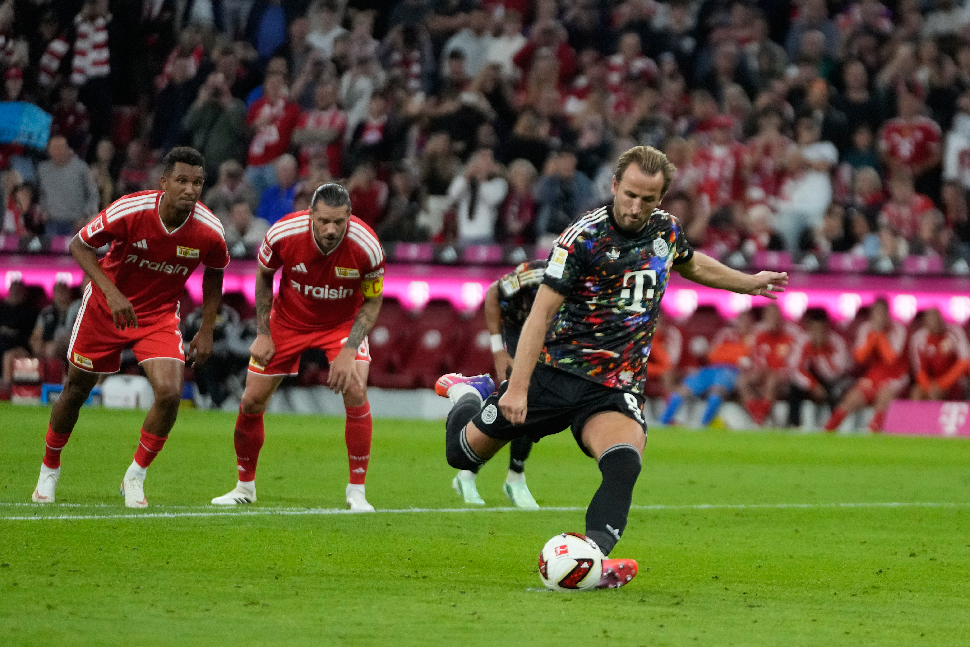 Bayern's Harry Kane scores his side's second goal by a penalty during the Bundesliga match against Union Berlin in Munich, Germany