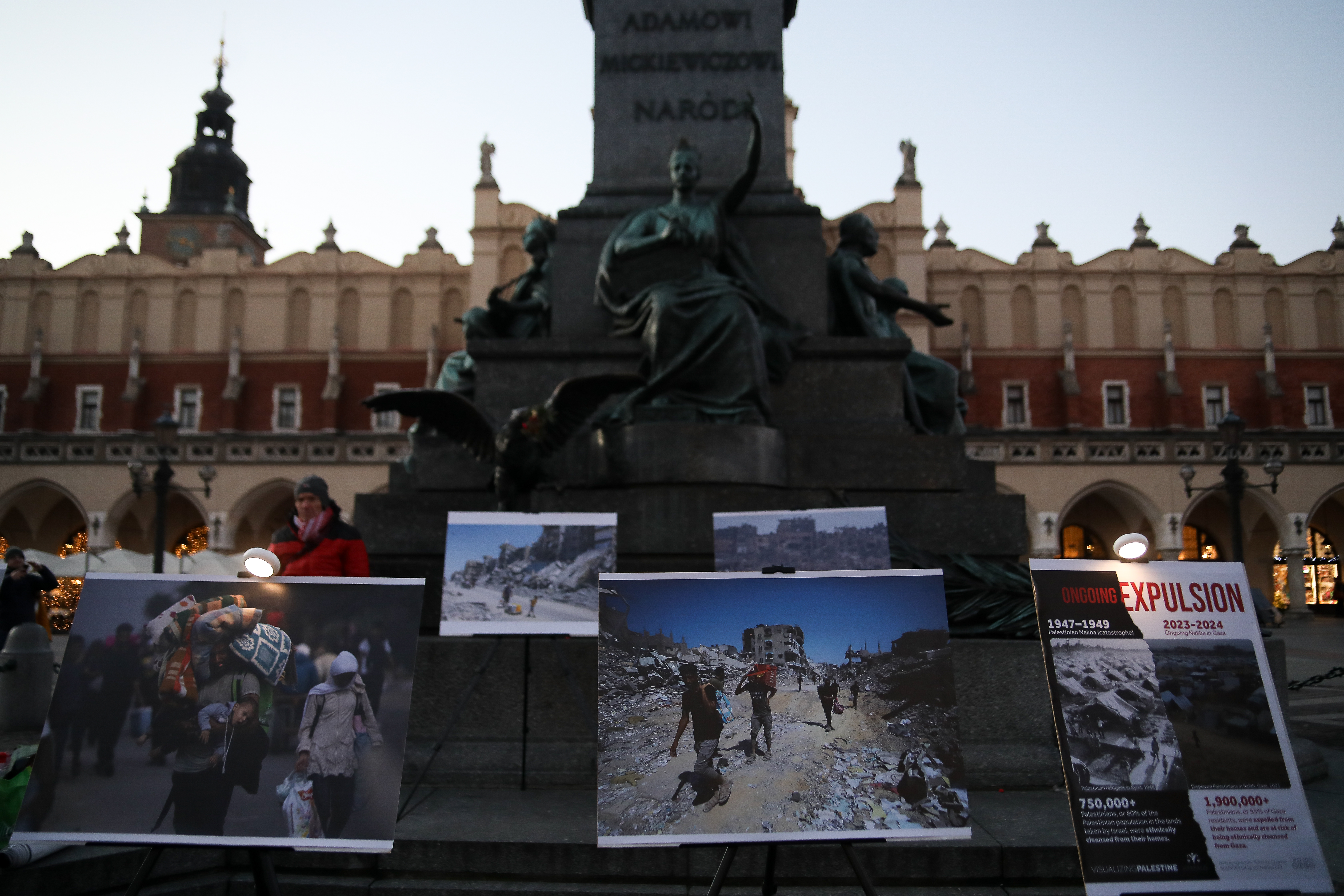 Photos from Palestine show a pro-Palestinian protest that gathers on the Main Square and then proceeds to the US Consulate in Krakow, Poland, on December 21, 2024. On October 7, at 6:30 a.m., Hamas attacks Israel with rockets, and militants enter its territory. Israel responds with a daily missile attack and cuts off water, food, and electricity supplies. The Gaza Strip is inhabited by 2.2 million people, half of whom are women and children. The victims are already counted in thousands. The prosecutor of the International Criminal Court requests the issuance of an arrest warrant for Israeli Prime Minister Benjamin Netanyahu. (Photo by Klaudia Radecka/NurPhoto via Getty Images)