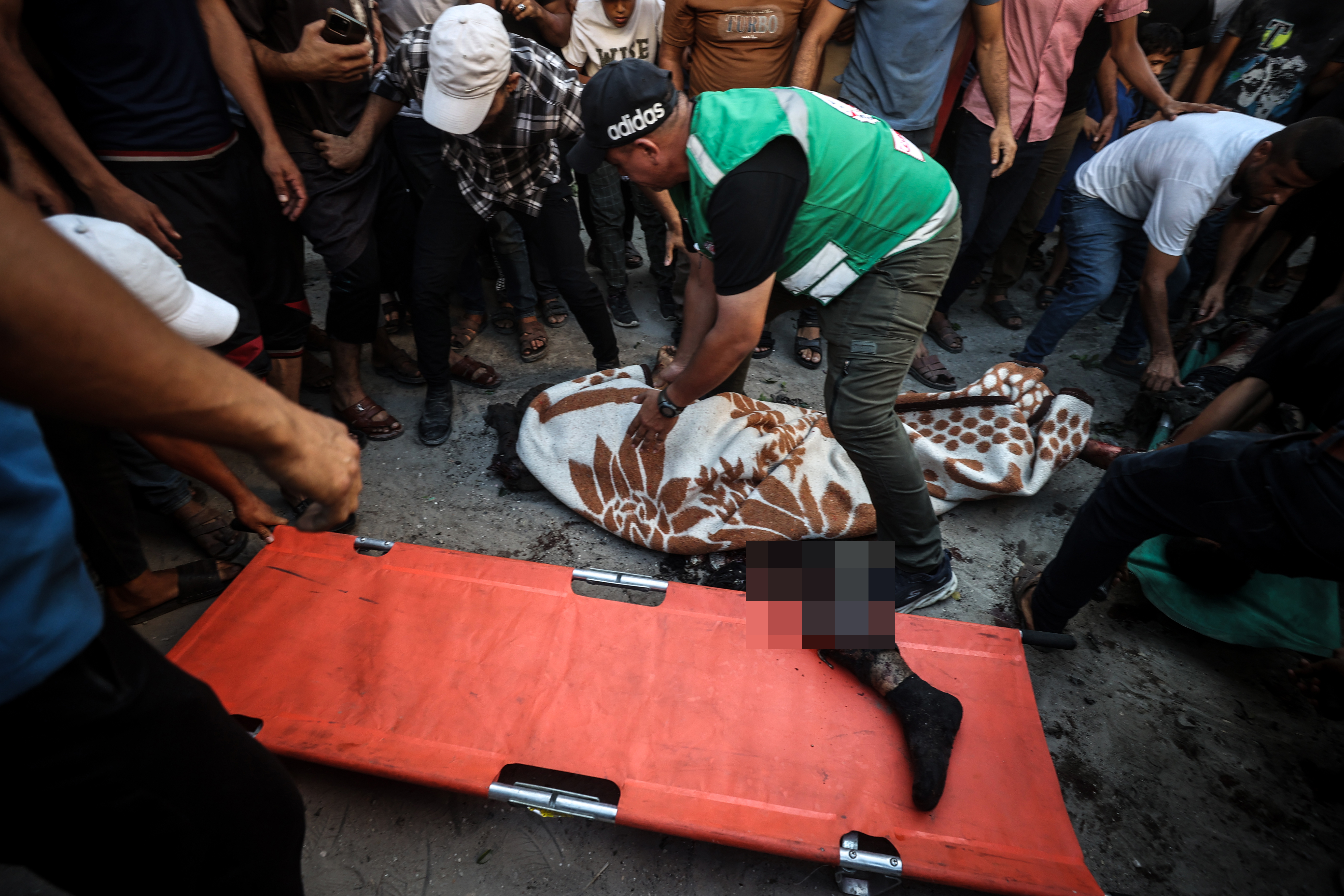 A view of a body as several people are killed and others are injured in an Israeli airstrike targeting a group of Palestinians on Al-Thawra Street in Gaza City, Gaza, Palestine