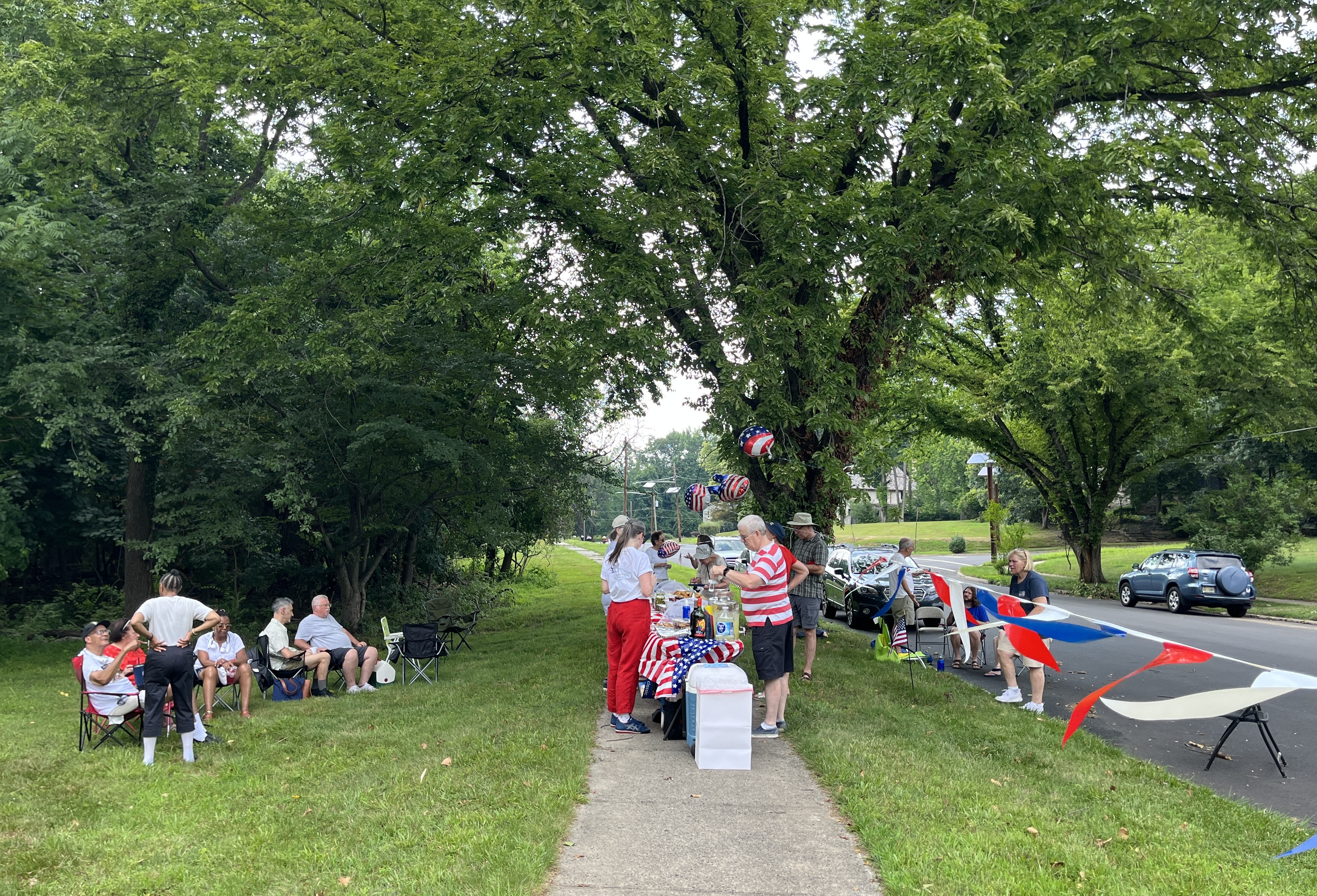 Residents of Trenton's Hiltonia neighbourhood gather to meet one another and enjoy a variety of foods on July 5, 2026 [Juhie Bhatia/Al Jazeera]