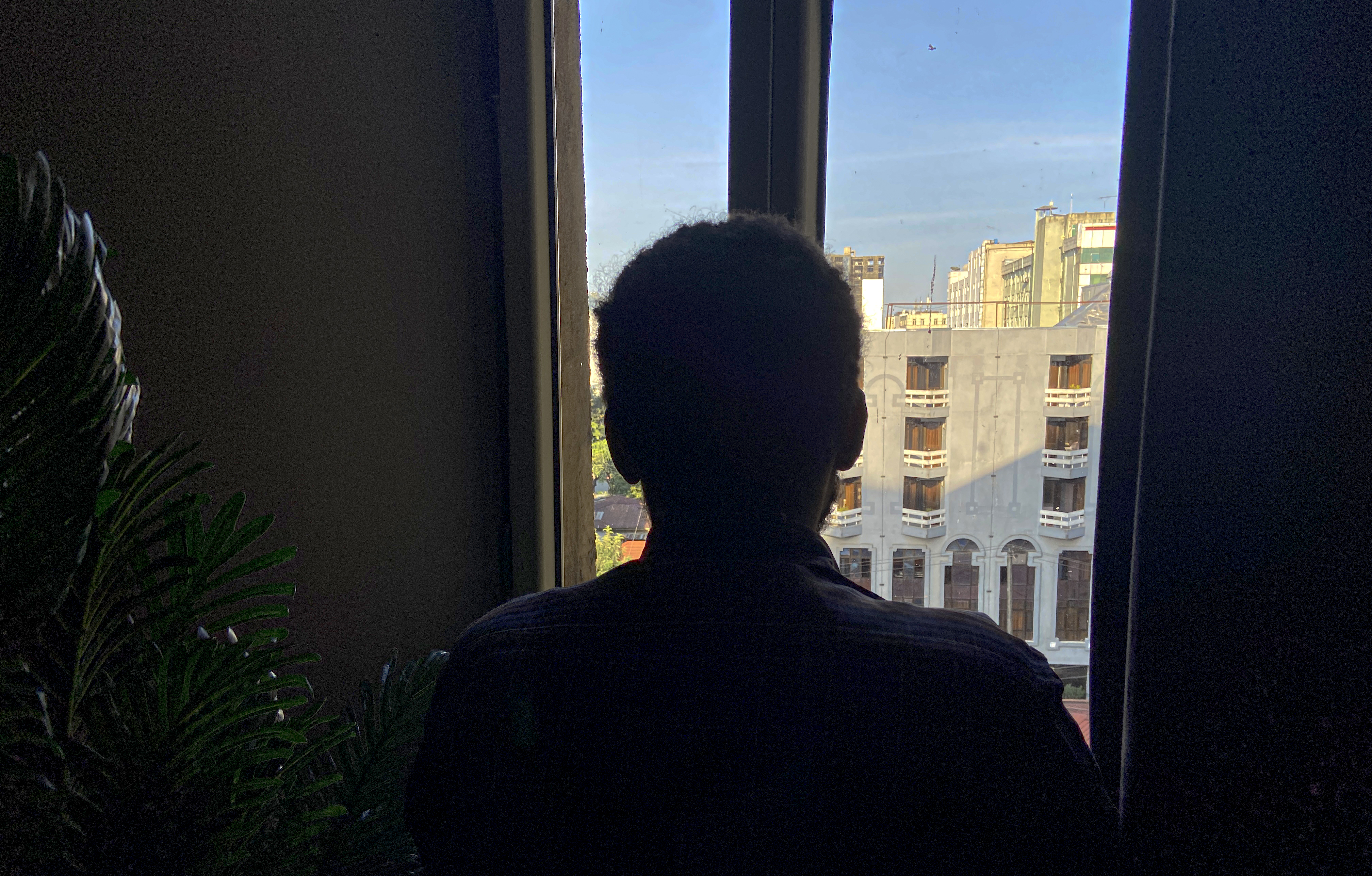 Shewit, 24, a Tigrayan who says he fled Tigray because he feared forced recruitment by the Tigray People’s Liberation Front (TPLF), poses for a photograph at his apartment after an interview with Al Jazeera in Addis Ababa, Ethiopia, September 22, 2026.