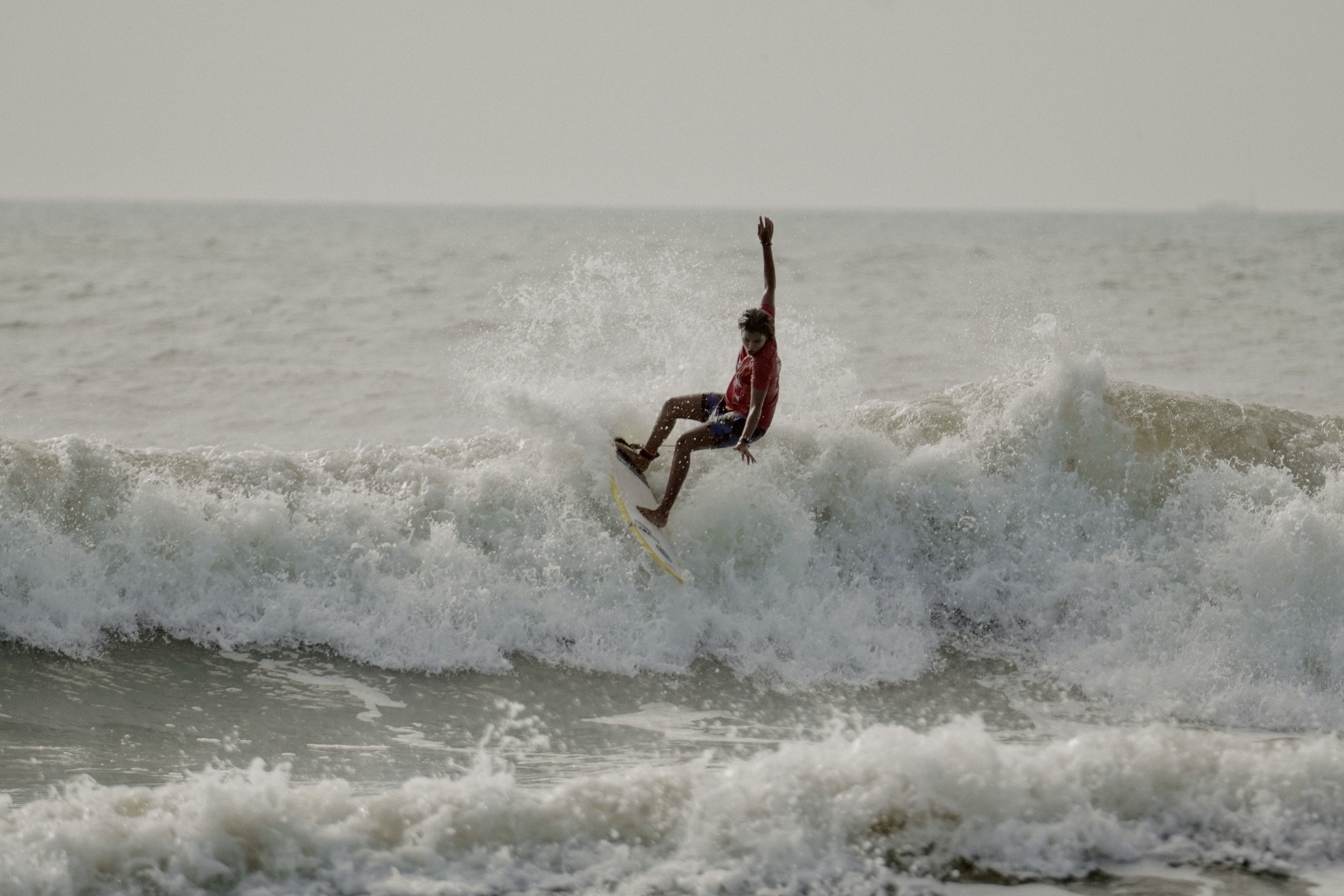 Sugar Shanti Banarse catches a wave [Photo courtesy of the Surfing Federation of India]