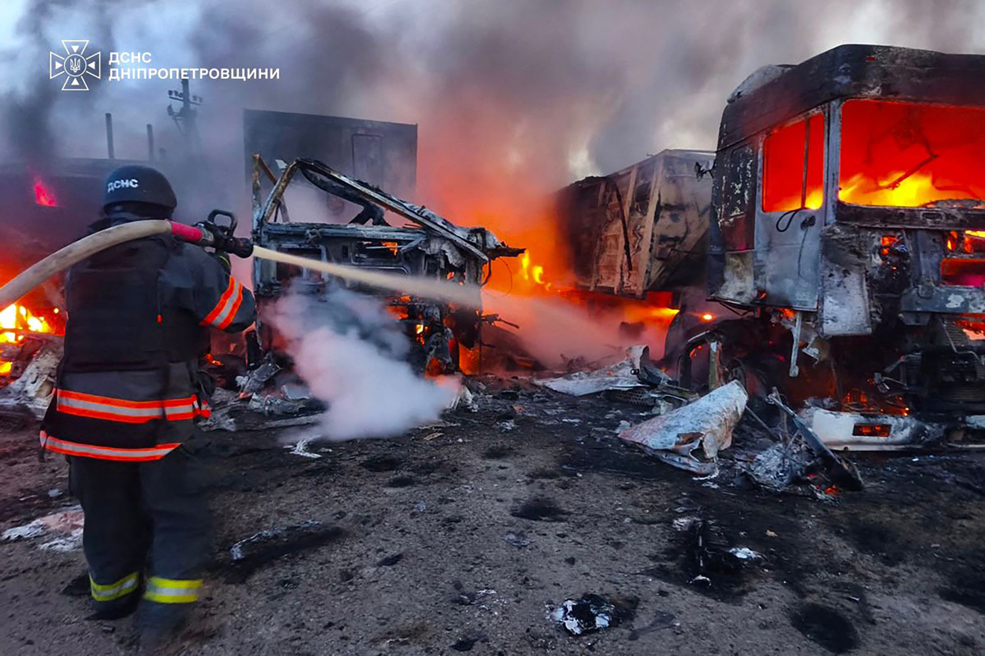 In this handout photograph taken and released by the Ukrainian Emergency Service on September 2, 2026, a Ukrainian rescuer works to extinguish a fire at the site of an air attack at an undisclosed location in the Dnipro region, amid the Russian invasion of Ukraine.