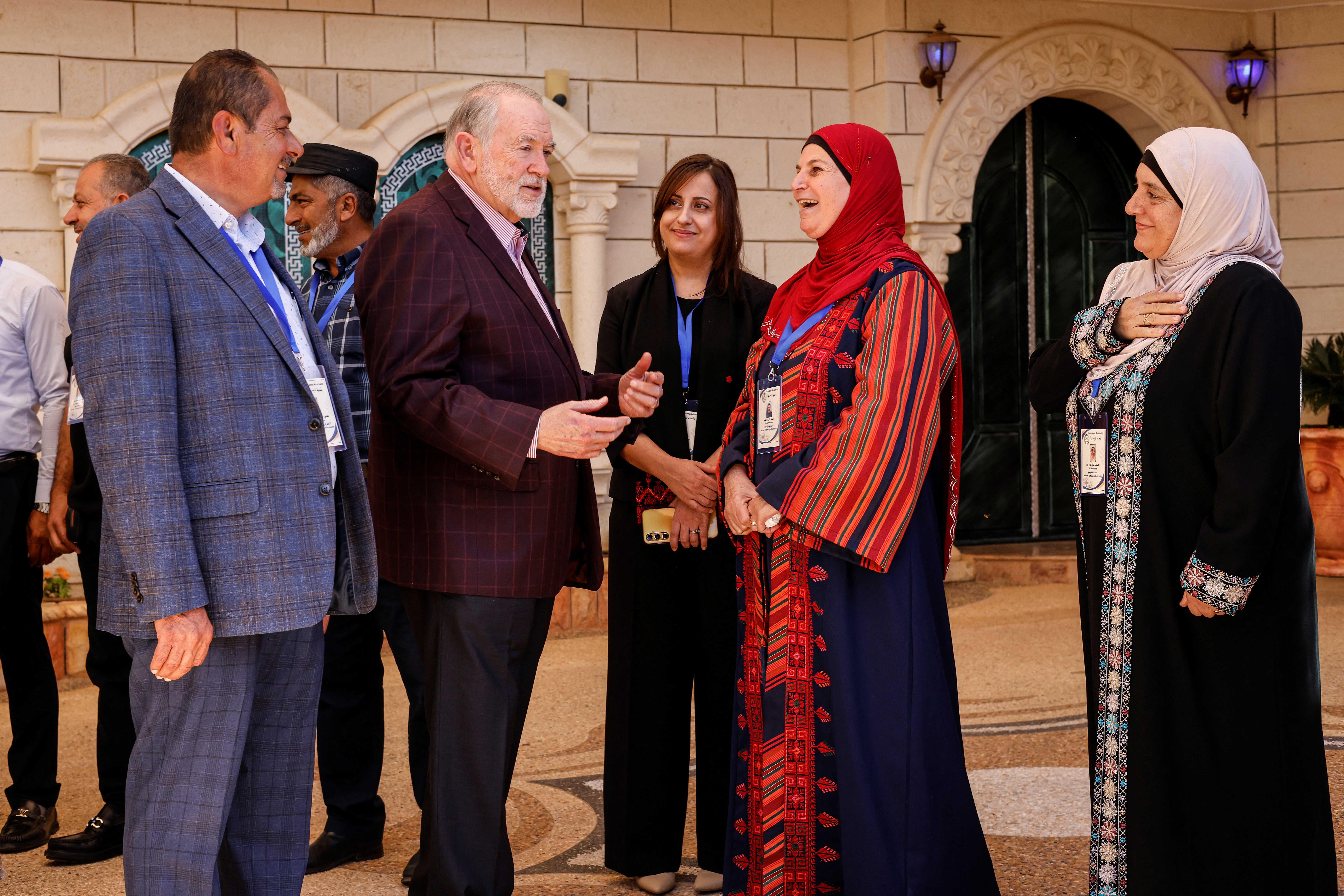 US Ambassador to Israel Mike Huckabee, second from left, is greeted by members of the local municipality as he arrives to visit the home of an American-Palestinian resident who has previously been attacked twice by Israeli settlers, on September 5, 2026.