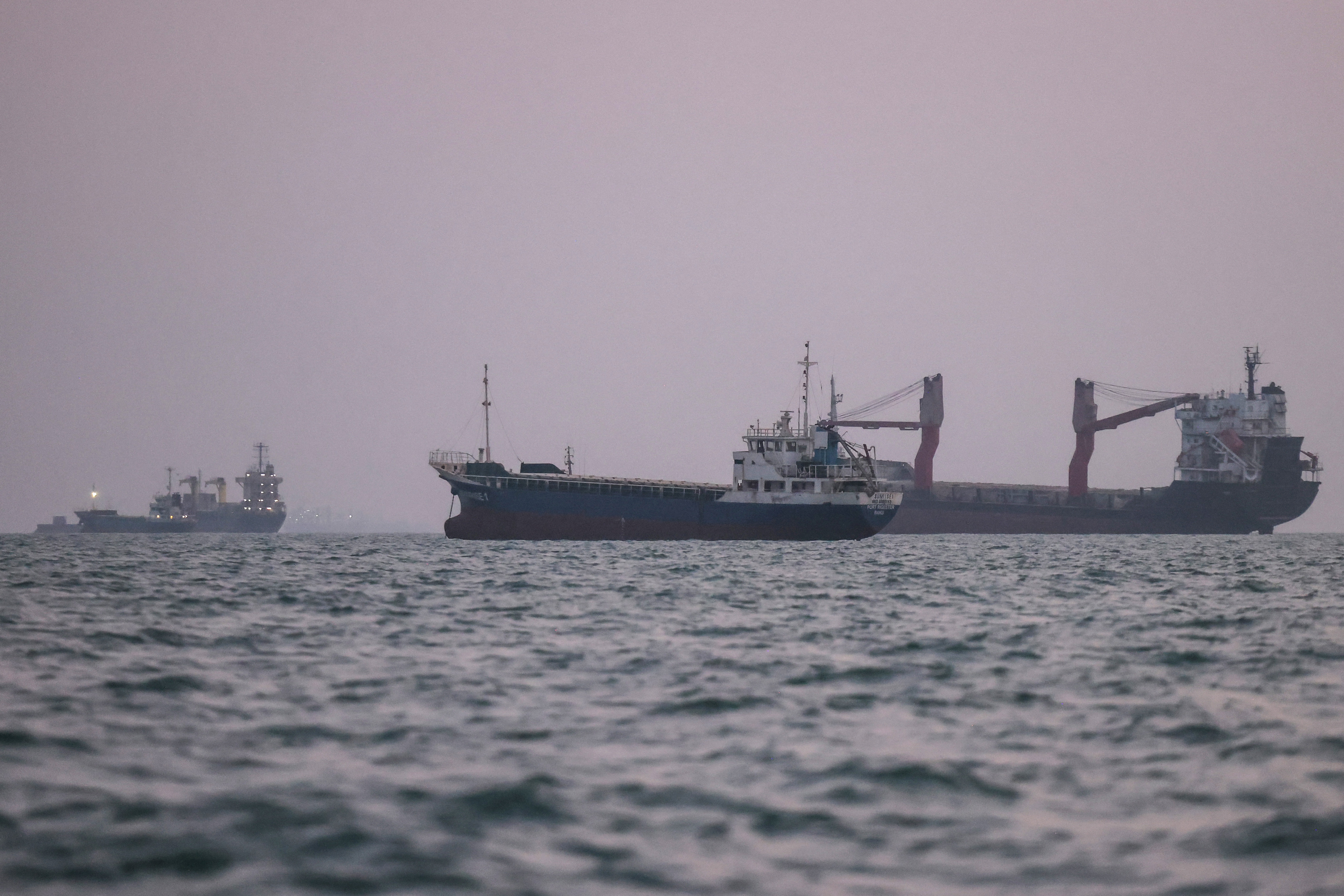 Vessels transit the Strait of Hormuz off the coast of the port city of Bandar Abbas in southern Iran