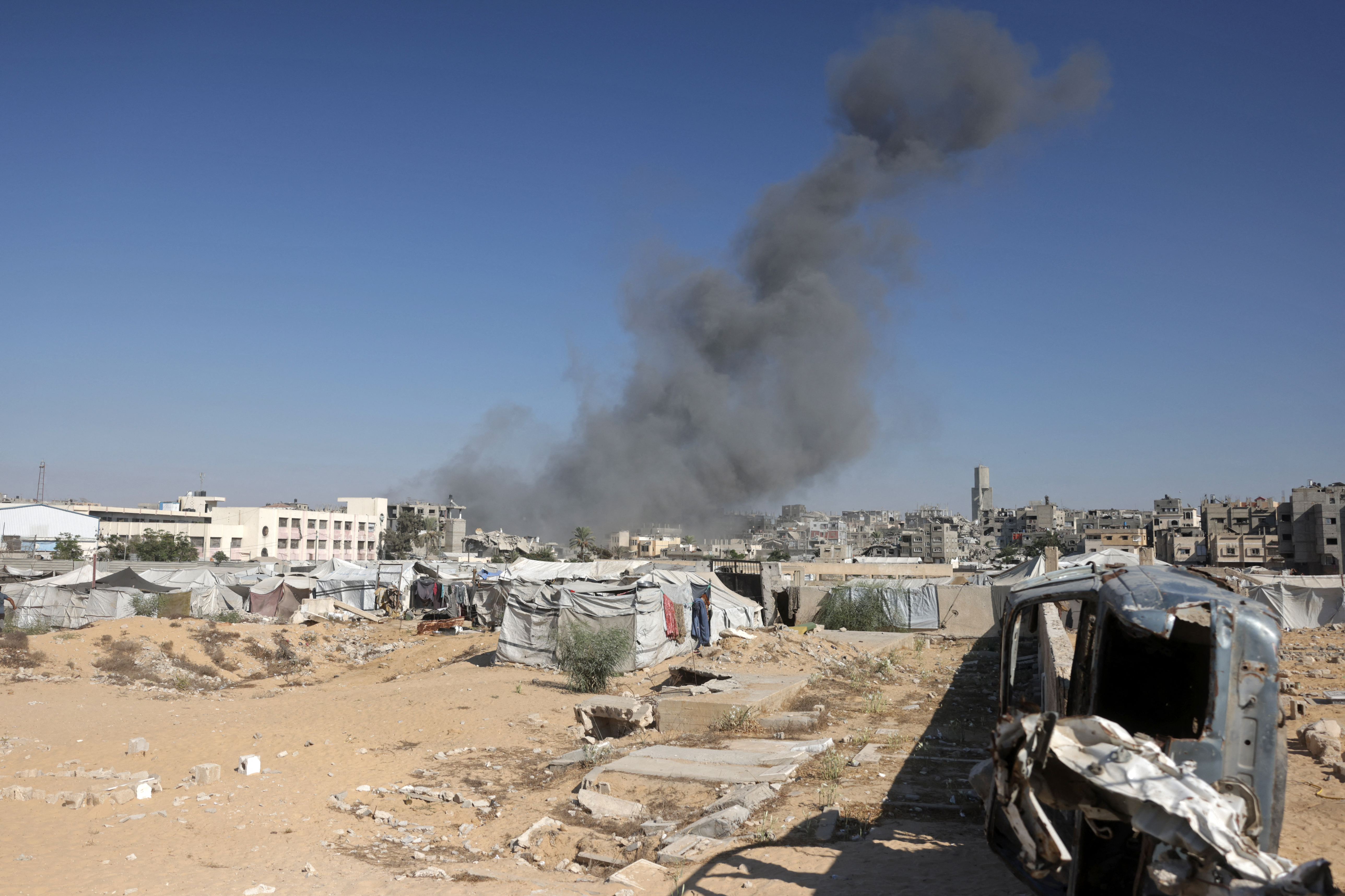 Smoke rises after a house was targeted by an Israeli strike in Khan Yunis, Gaza Strip