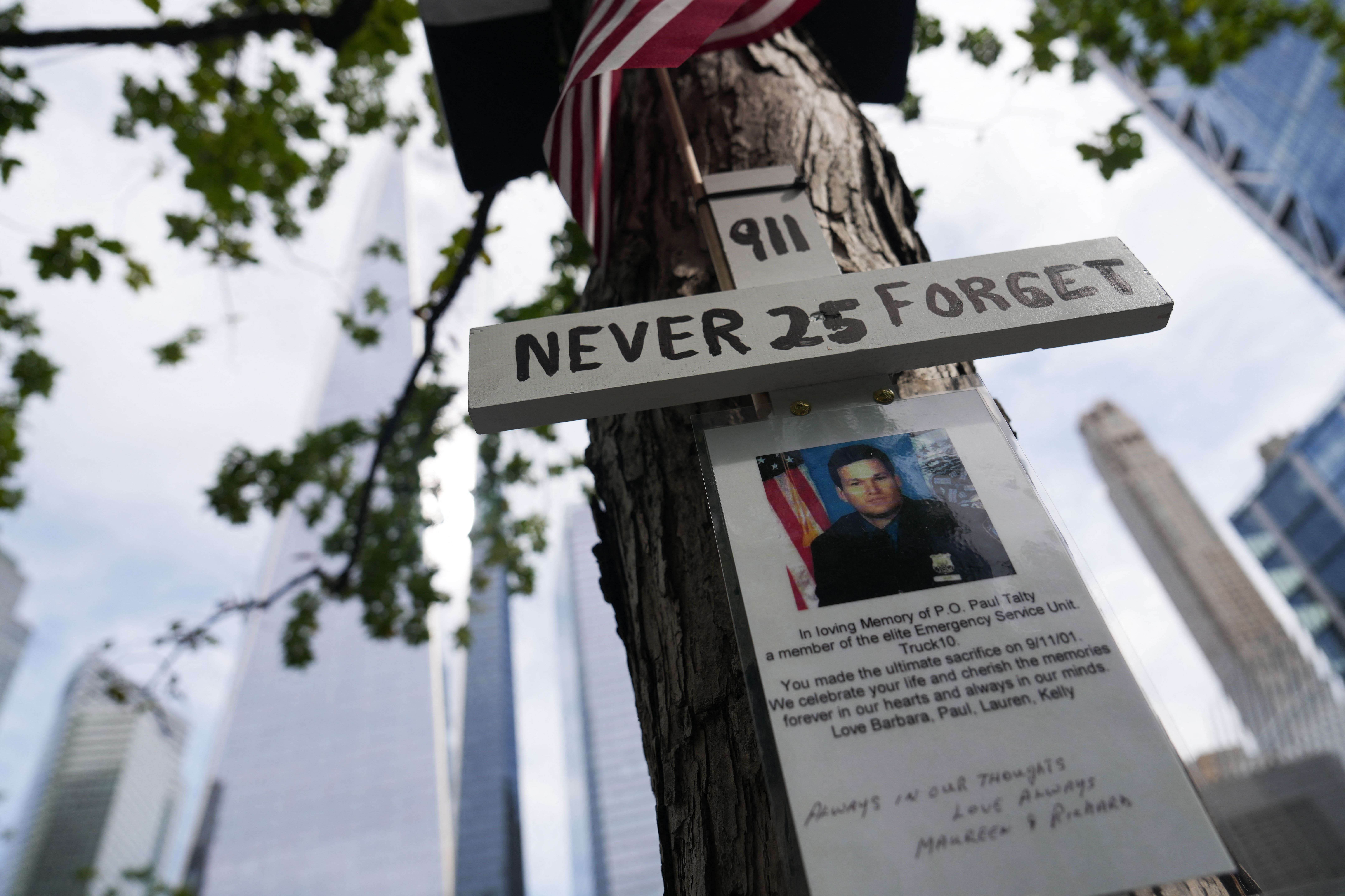 A picture of a victim of the September 11, 2001 attacks is seen during the 25th anniversary commemoration of the event at the National September 11 Memorial in New York on September 11, 2026. (Photo by DAVID DEE DELGADO / POOL / AFP)