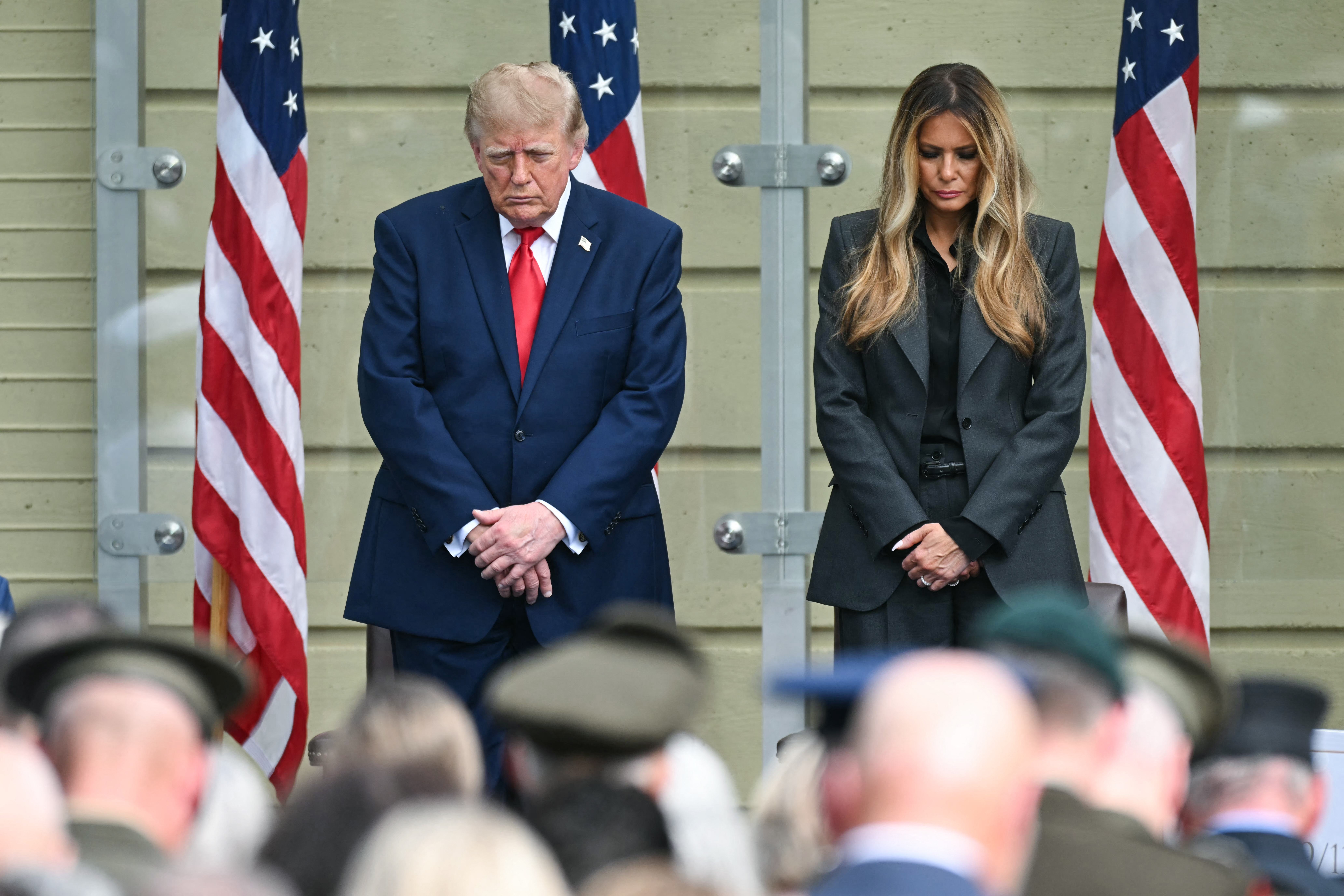 US President Donald Trump and US First Lady Melania Trump bow their heads during the 25th anniversary commemoration of the September 11, 2001 attacks at the Pentagon in Washington, DC, on September 11, 2026. (Photo by SAUL LOEB / AFP)