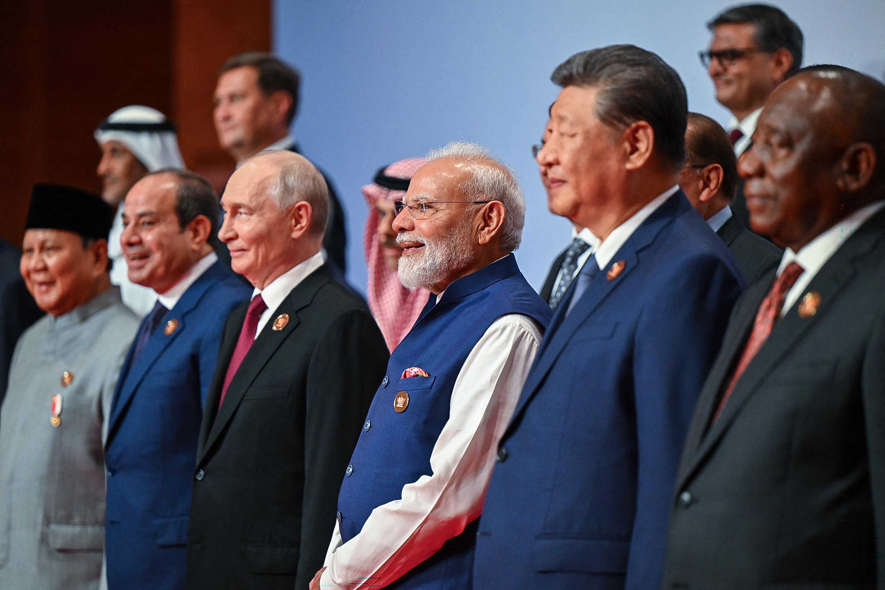 This handout photograph taken and released by Indian Press Information Bureau (PIB) on September 13, 2026 shows Russia's President Vladimir Putin (3L), India's Prime Minister Narendra Modi (3R) and China's President Xi Jinping (2R) posing with other leaders for a family photo during the 18th BRICS Summit in New Delhi. (Photo by Handout / Indian Press Information Bureau (PIB) / AFP) / RESTRICTED TO EDITORIAL USE - MANDATORY CREDIT "AFP PHOTO /INDIAN PRESS INFORMATION BUREAU (PIB)/ HANDOUT / " - NO MARKETING NO ADVERTISING CAMPAIGNS - DISTRIBUTED AS A SERVICE TO CLIENTS