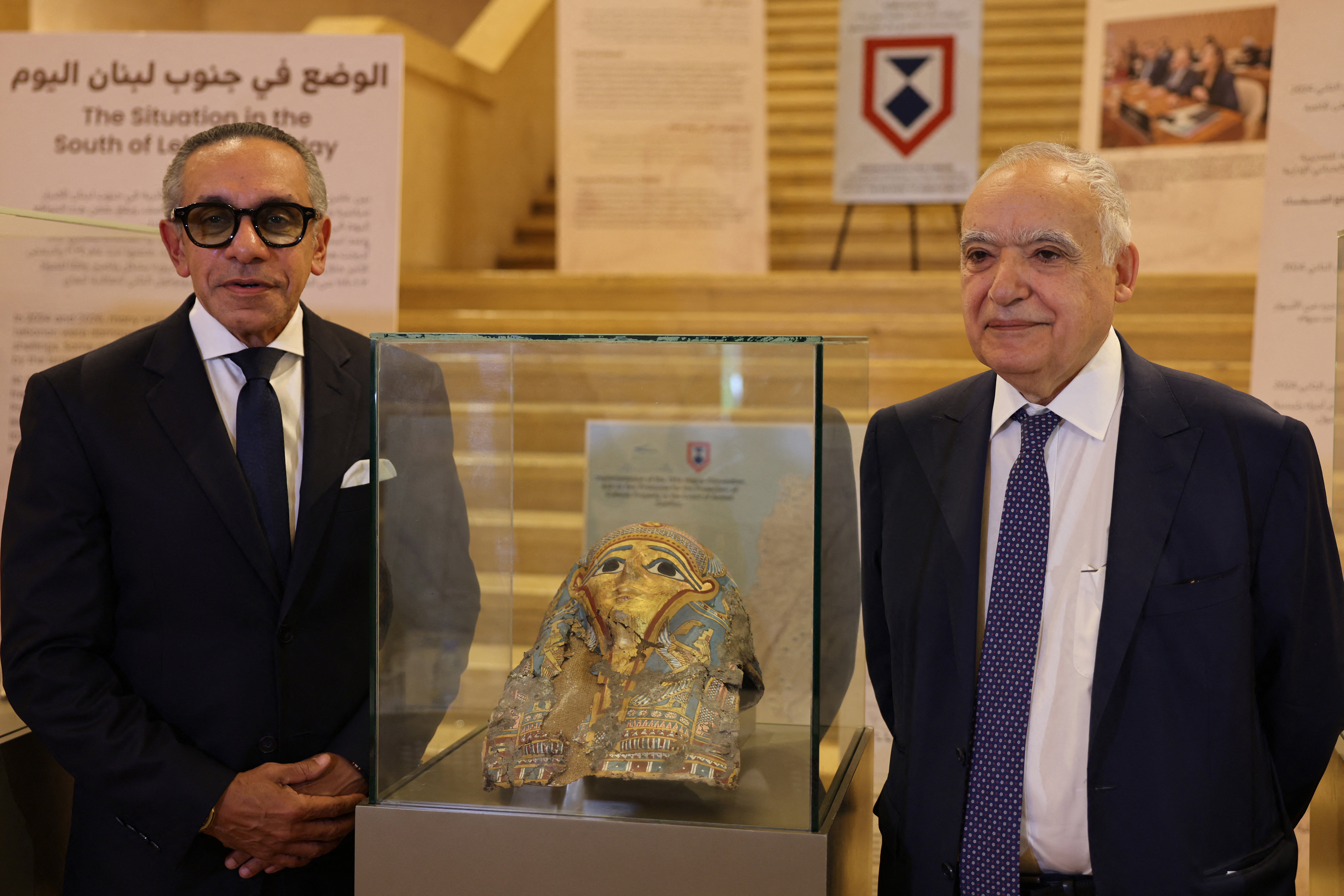 Lebanon's Culture Minister Ghassan Salameh (R) and Egypt's Ambassador to Lebanon Alaa Moussa pose next to illegally smuggled artifacts that date back to the Egyptian pharaonic era