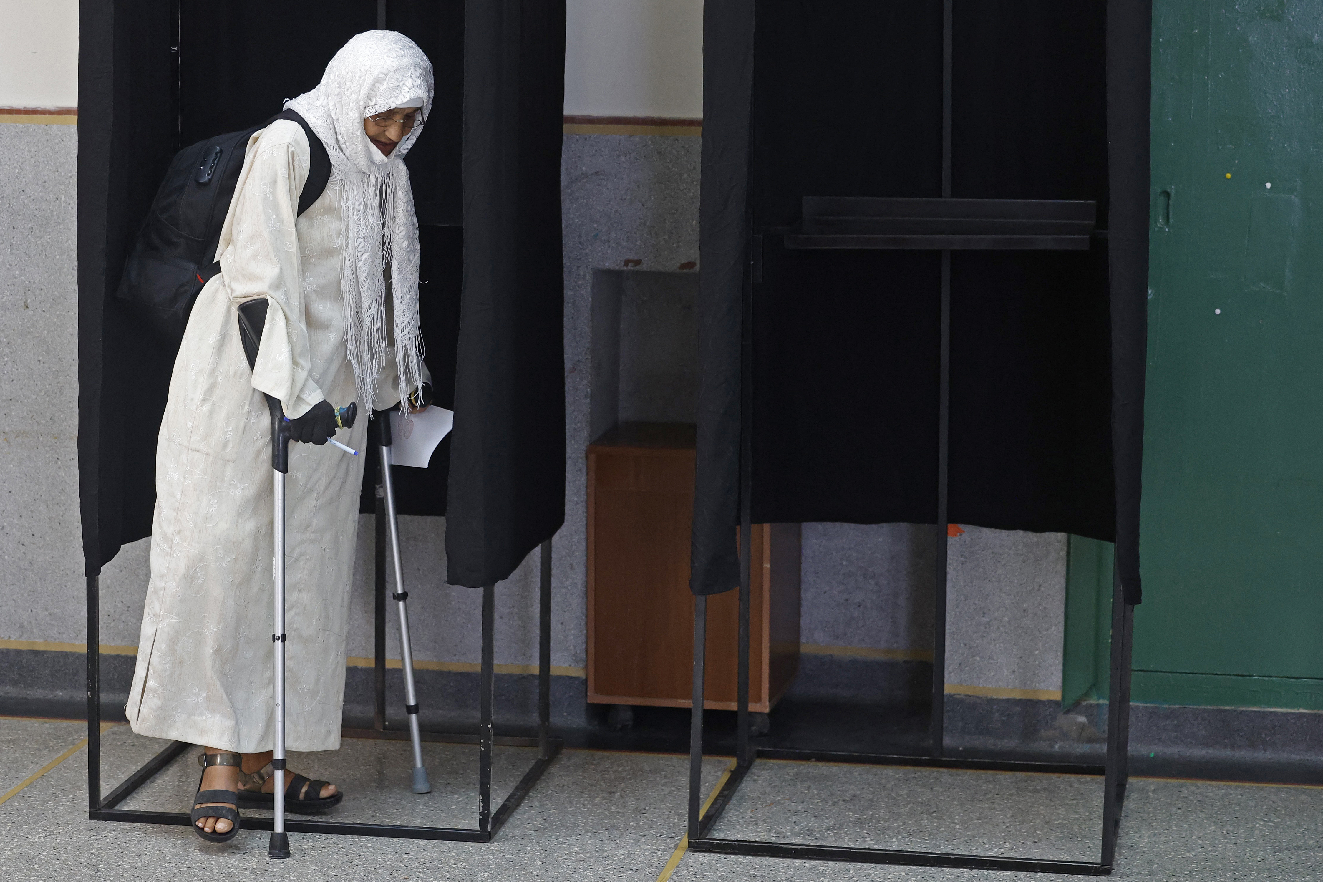 A woman prepares to cast her ballot to vote in Morocco’s legislative elections at a polling station inside a school at the Udayas neighbourhood, Rabat, on September 23, 2026 [AFP]
