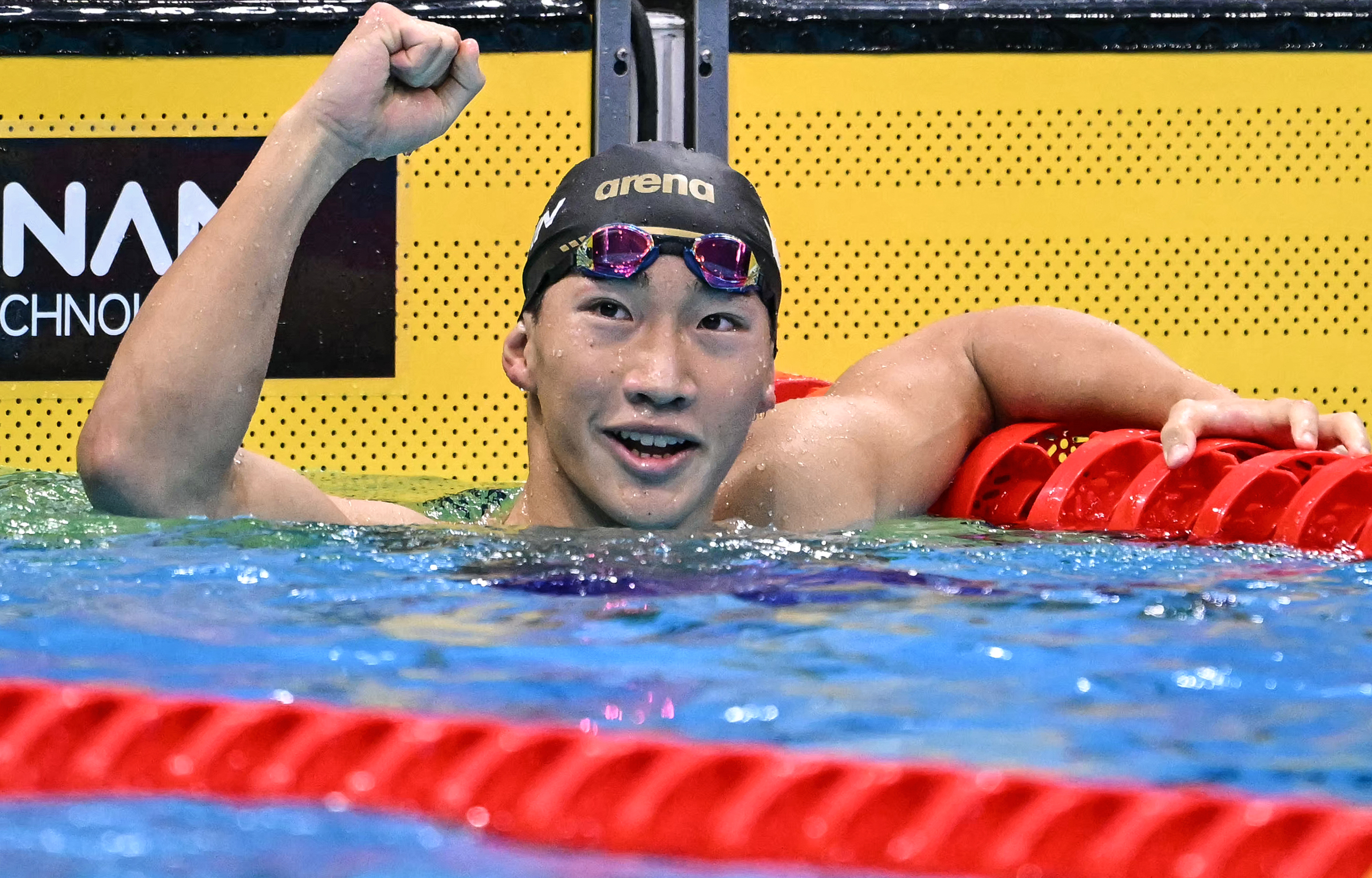 TOPSHOT - Gold medallist Japan's Shin Ohashi celebrates after breaking the world record while competing in the final of the men's 200m breaststroke swimming event during the 2026 Asian Games at the Tokyo Aquatics Centre in Tokyo on September 24, 2026.