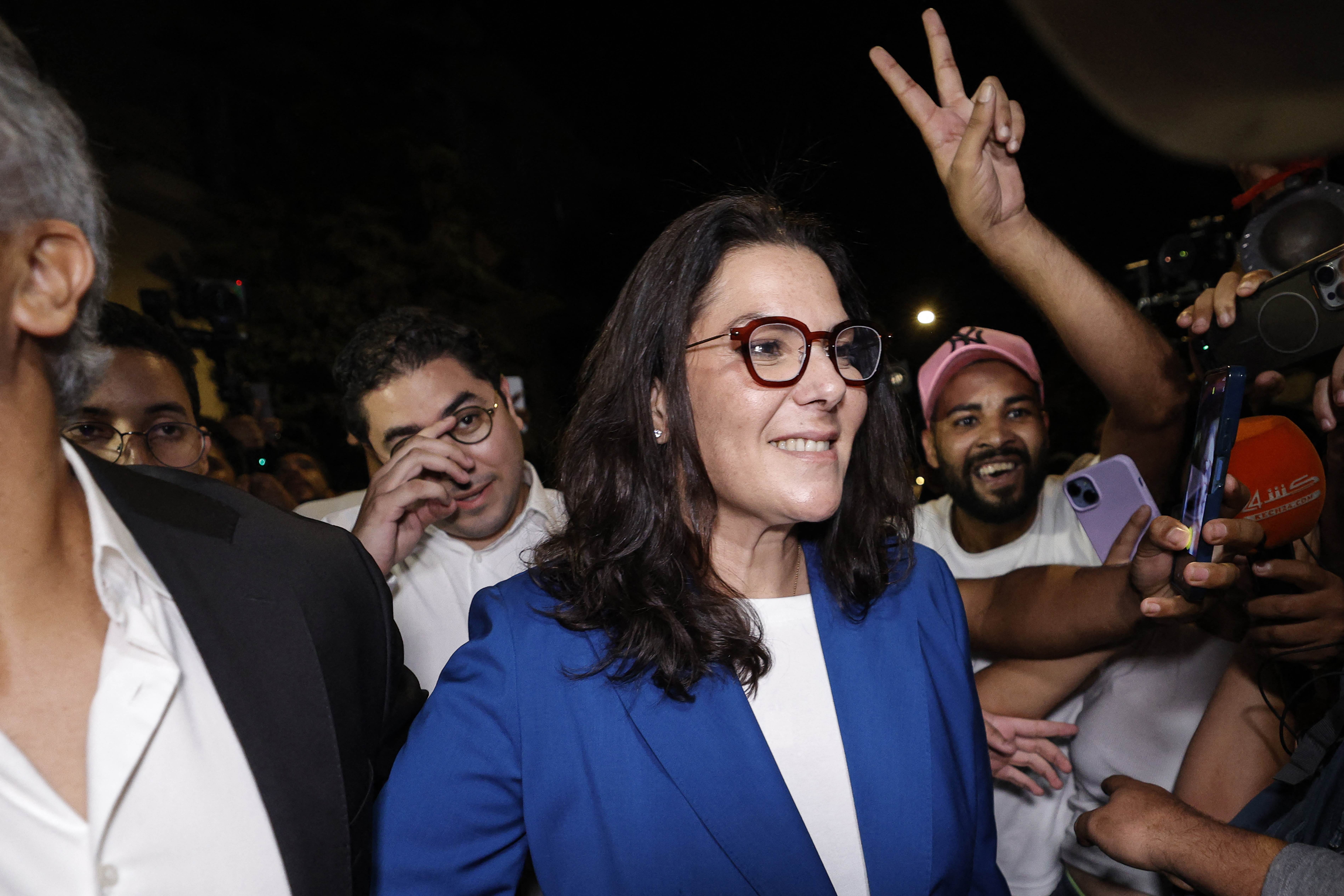 Fatima Zahra Al Mansouri (C), a member of the collective leadership of Morocco’s Authenticity and Modernity Party (PAM), celebrates with party members after the announcement of provisional results in the legislative elections, in the early hours of September 24, 2026 [AFP]