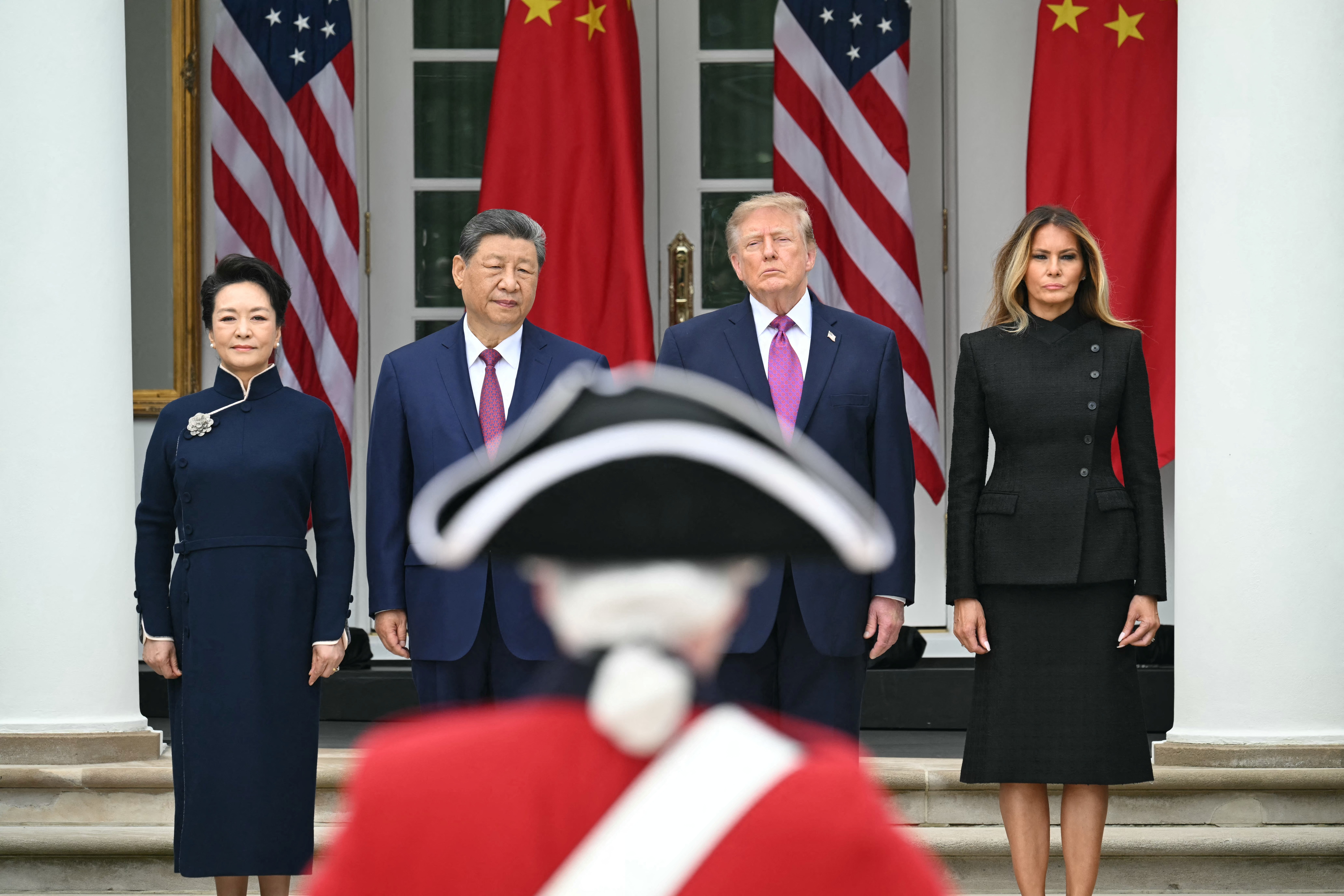 (L/R) China's First Lady Peng Liyuan, China's President Xi Jinping, US President Donald Trump and US First Lady Melania Trump look on during a military review in the Rose Garden of the White House in Washington, DC, on September 24, 2026.