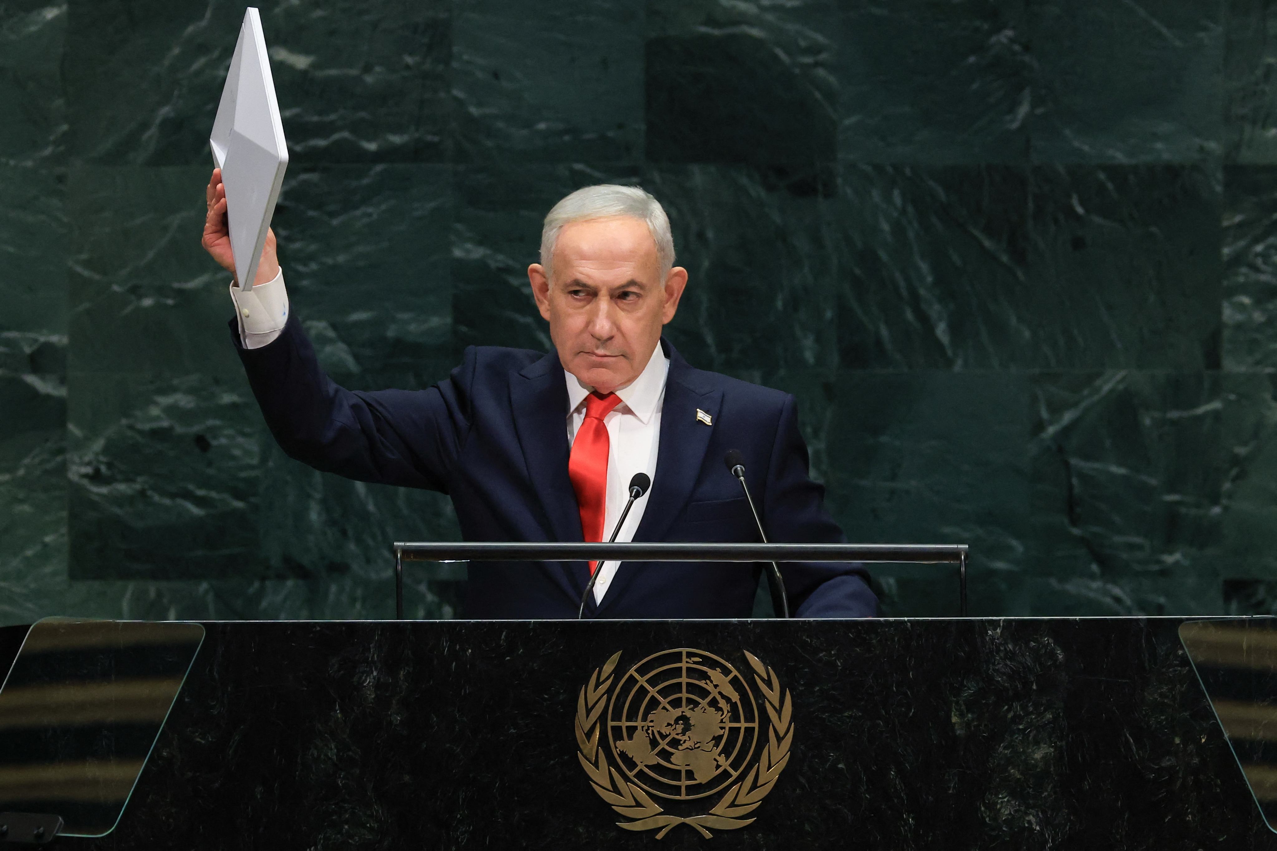 Israel's Prime Minister Benjamin Netanyahu holds up a Starlink device as he speaks during the 81st United Nations General Assembly at the United Nations Headquarters in New York, on September 24, 2026. (Photo by TIMOTHY A. CLARY / AFP)