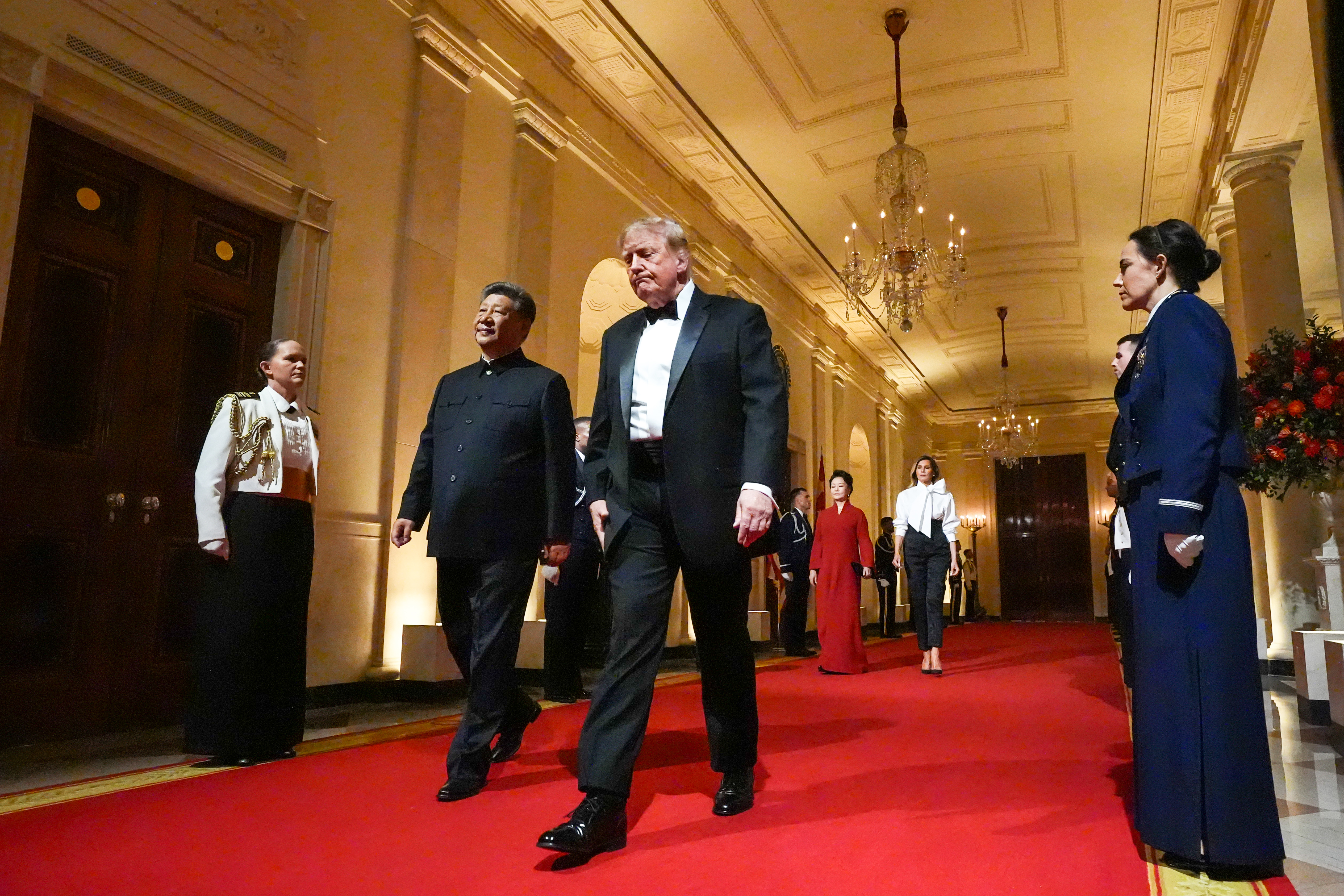 President Donald Trump, first lady Melania Trump, China's President Xi Jinping and his wife Peng Liyuan walk in the Cross Hall to a State Dinner in the East Room at the White House, Thursday, Sept. 24, 2026, in Washington. (AP Photo/Alex Brandon)