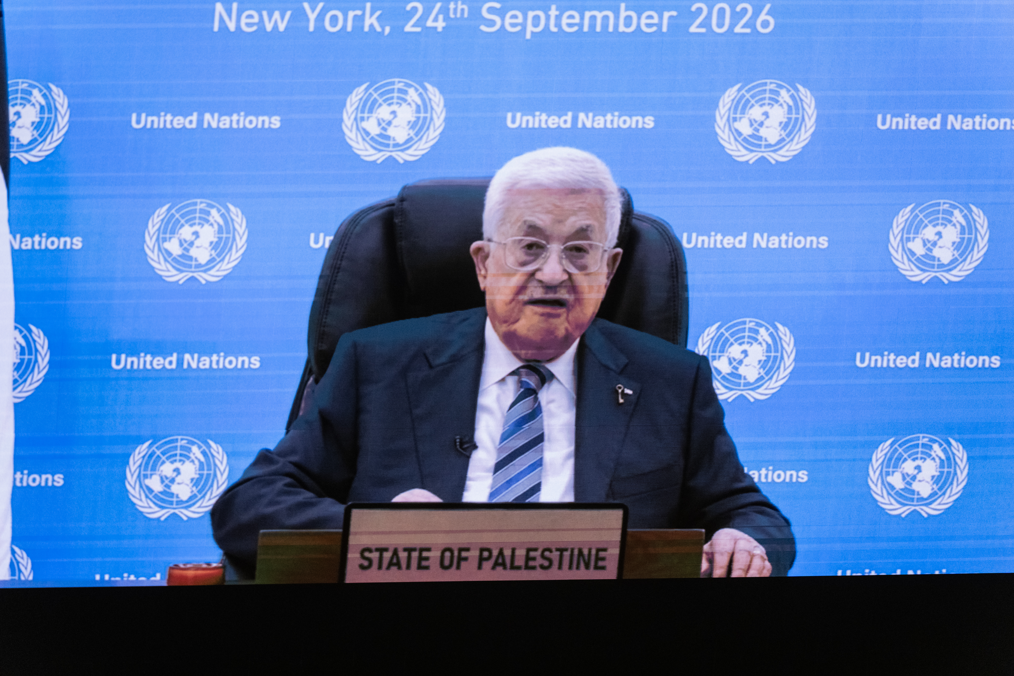 epa13259830 President of the State of Palestine Mahmoud Abbas appears on a screen as he speaks during a virtual address, since the US State Department refused to issue visas for the Palestinian delegation, during the General Debate of the 81st session of the United Nations General Assembly (UNGA) at United Nations Headquarters in New York, New York, USA, 24 September 2026. EPA/LEV RADIN