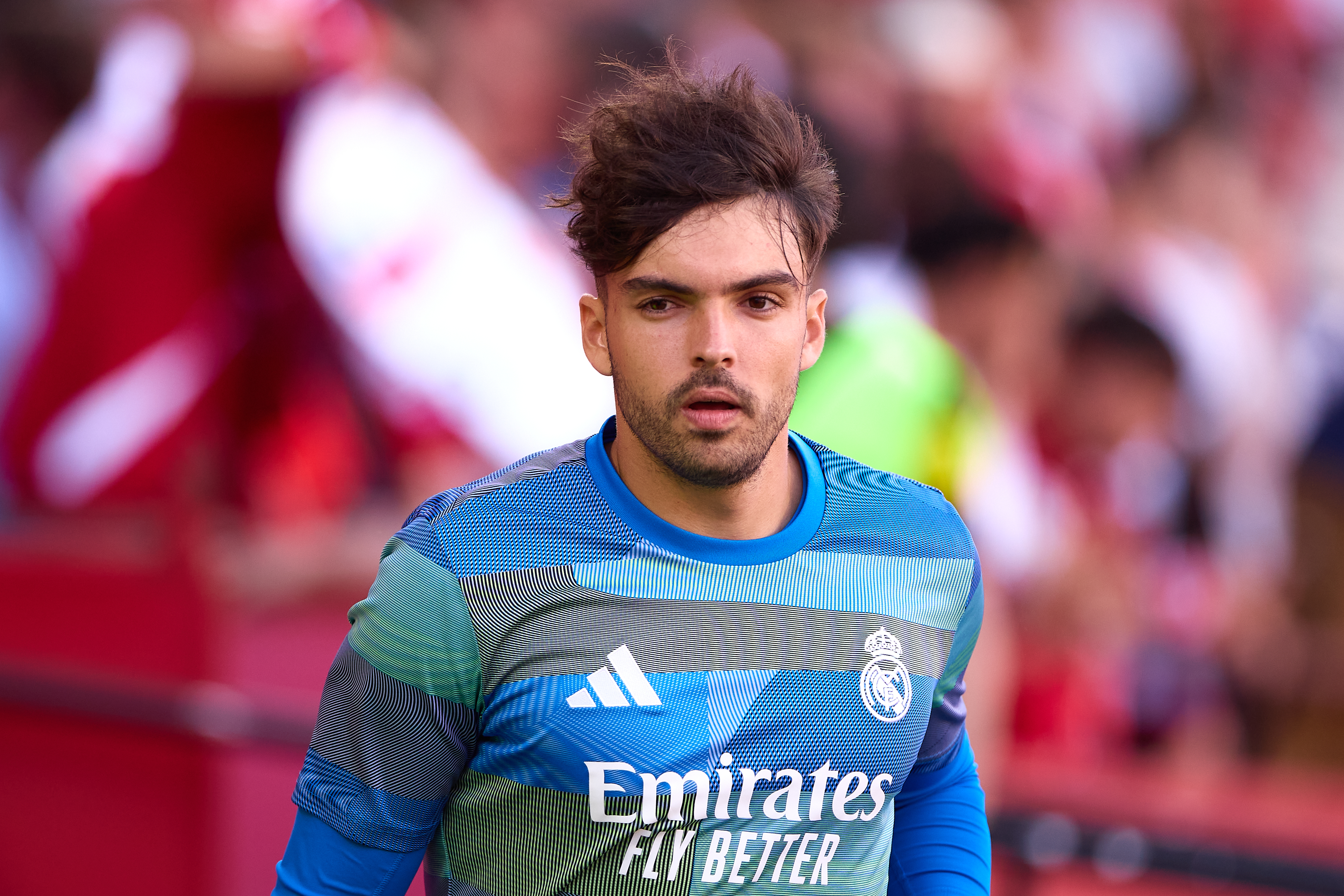 SEVILLE, SPAIN - MAY 17: Raul Asencio of Real Madrid looks on prior to the LaLiga EA Sports match between Sevilla FC and Real Madrid CF at Estadio Ramon Sanchez Pizjuan on May 17, 2026 in Seville, Spain. (Photo by Fran Santiago/Getty Images)