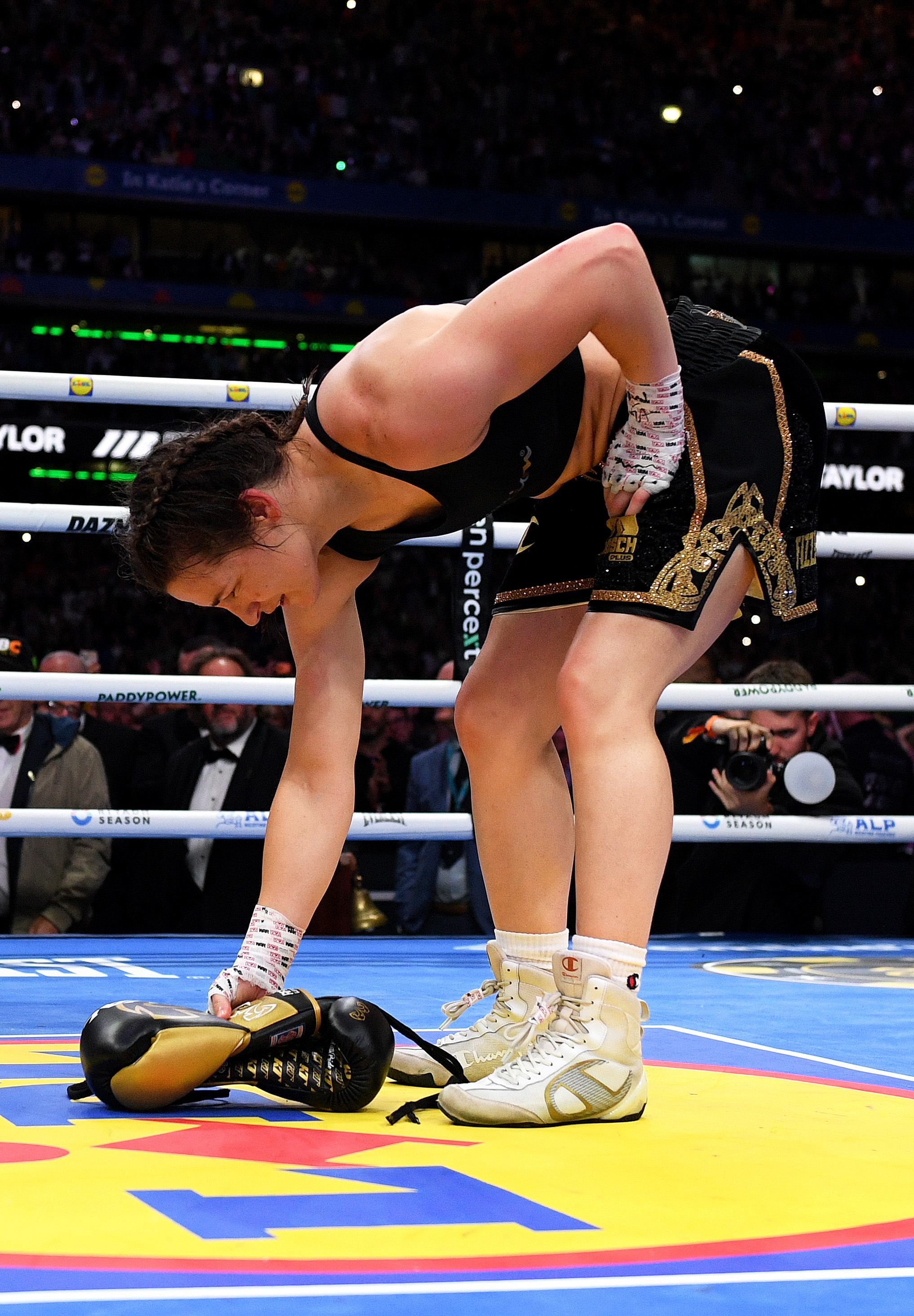 DUBLIN, IRELAND - SEPTEMBER 05: Katie Taylor places her gloves in the middle of the ring following victory in her final fight, the Women's IBF, IBO, WBC and WBO World Super Lightweight Titles' fight between Katie Taylor and Flora Pili on the Katie Taylor v Flora Pili: Once Upon A Time - Fight Night at Croke Park on September 05, 2026 in Dublin, Dublin. (Photo by Charles McQuillan/Getty Images)