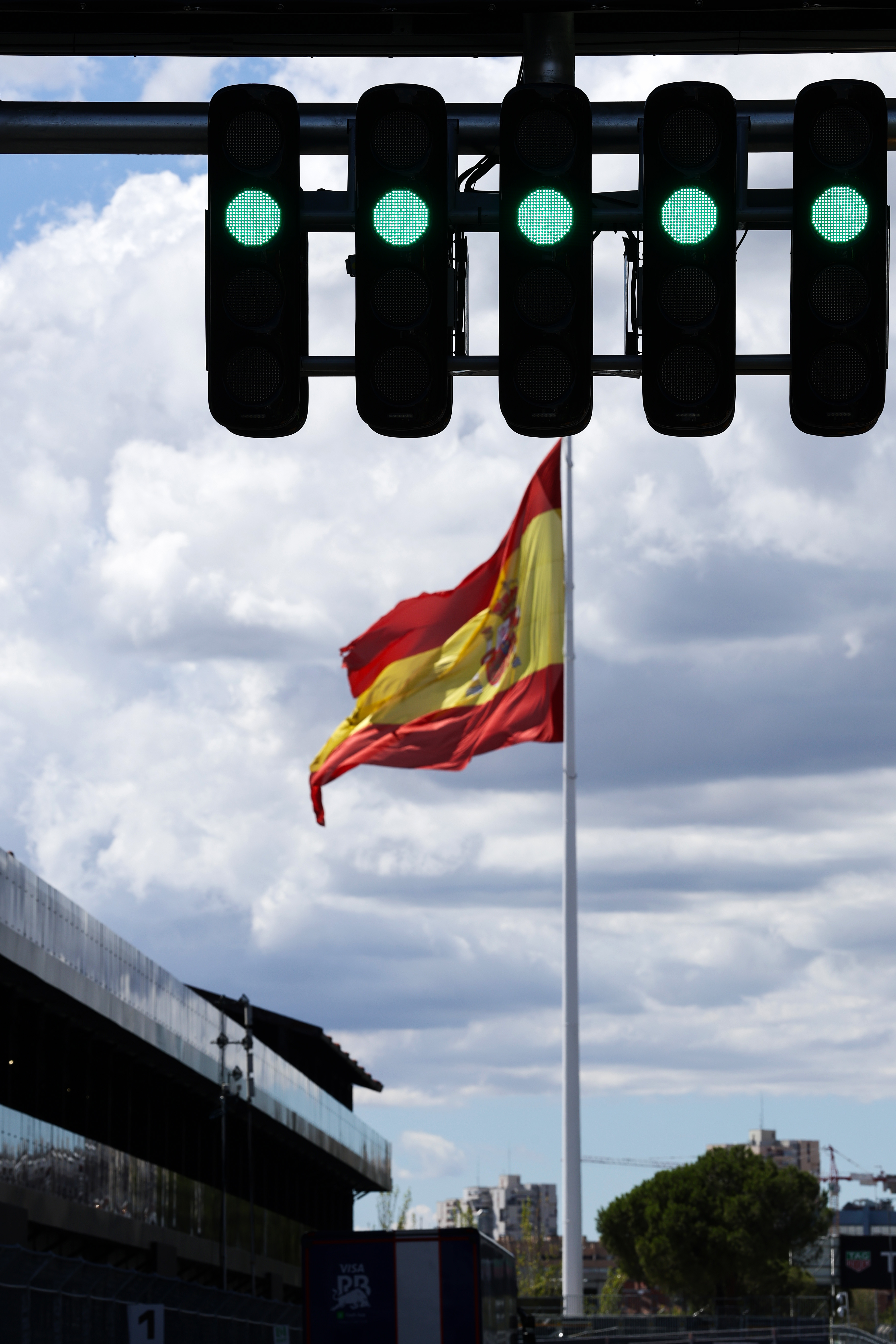 MADRID, SPAIN - SEPTEMBER 09: Start light gantry detail in the foreground, while a Spanish flag flies in the distance, during previews ahead of the F1 Grand Prix of Spain at Madring on September 09, 2026 in Madrid, Spain. (Photo by Mark Thompson/Getty Images)