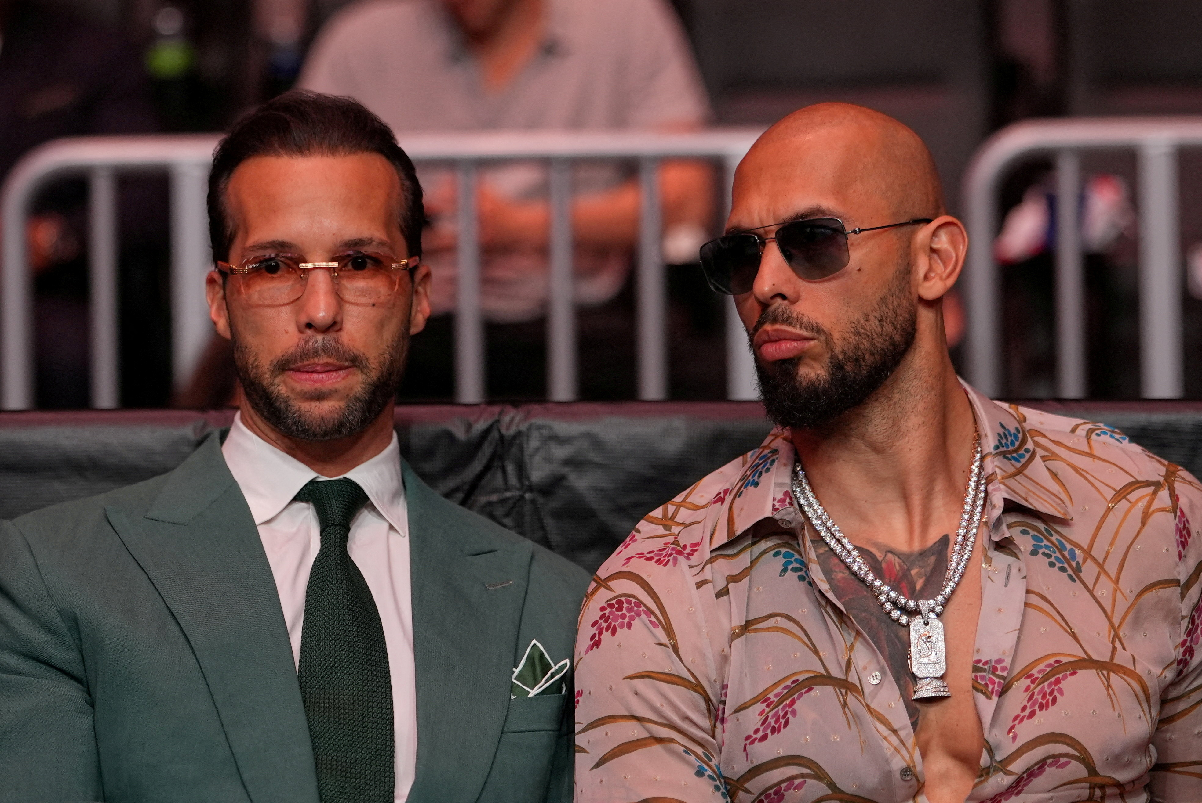 FILE PHOTO: Andrew Tate and Tristan Tate arrive before U.S. President Donald Trump to attend UFC 327 at Kaseya Center, Miami, U.S., April 11, 2026. Julia Demaree Nikhinson/Pool via REUTERS/File Photo