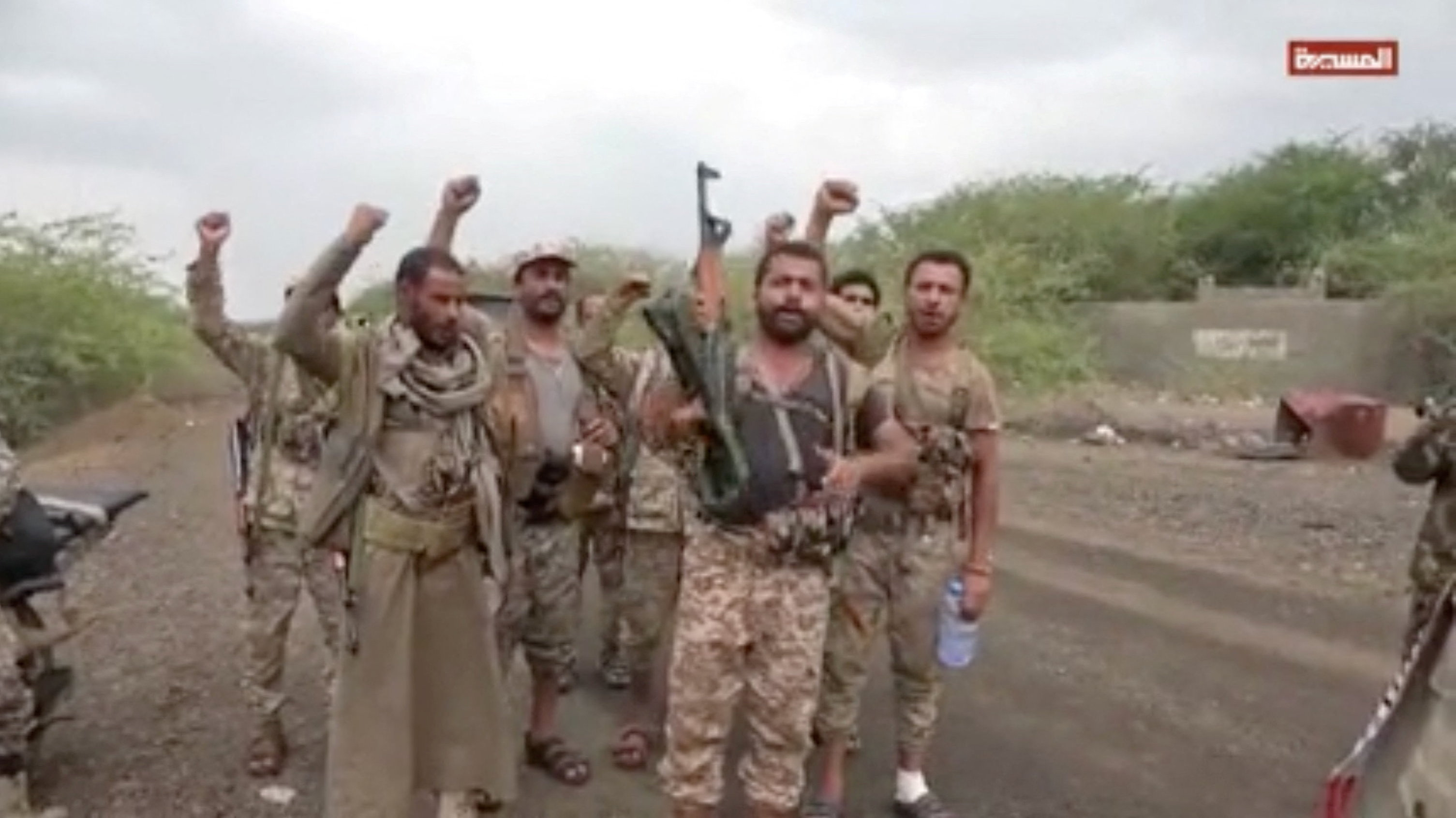 Men gesture in a screen grab from a video released September 11, 2026 and said to show Khaled bin Walid camp after Houthis captured the city of Mocha in Taiz Province, AL-MASIRAH TV/Handout via REUTERS ATTENTION EDITORS - THIS IMAGE HAS BEEN SUPPLIED BY A THIRD PARTY. Verification: Reuters could not independently verify the location and date where the video was filmed. No older version of the footage was found online before September 11.