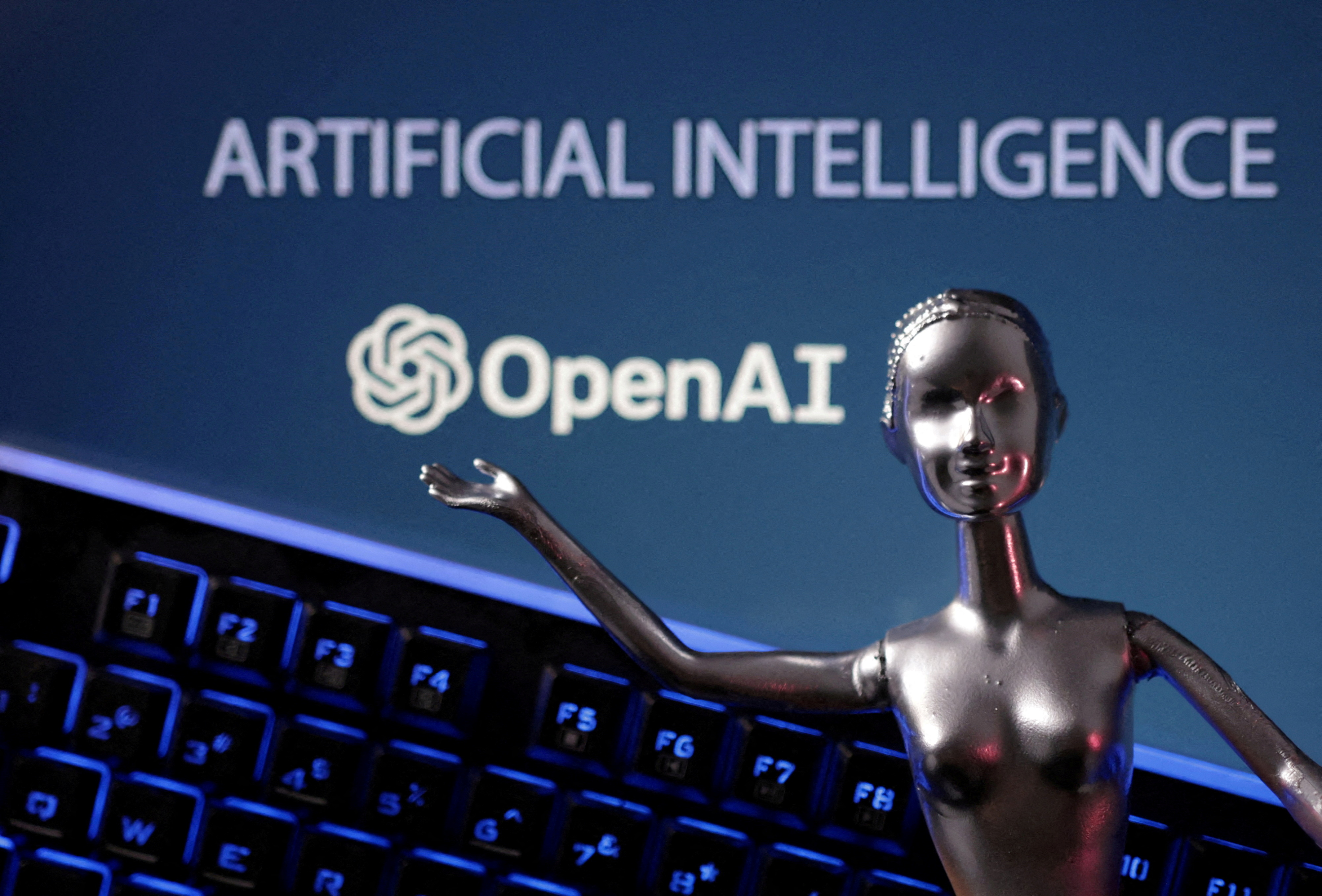 FILE PHOTO: OpenAI logo and AI Artificial Intelligence words are seen in this illustration taken, May 4, 2023. REUTERS/Dado Ruvic/Illustration/File Photo