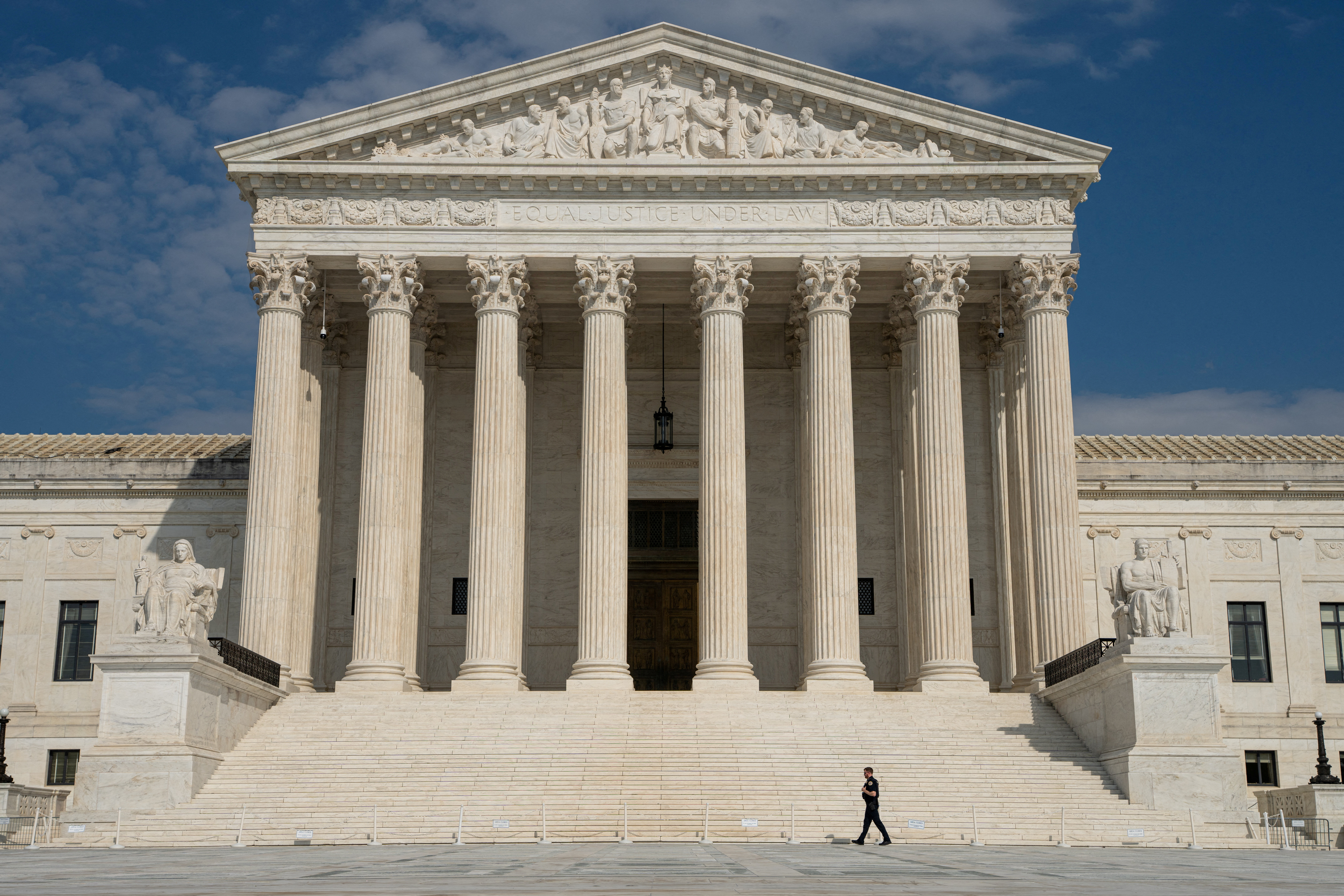The white marble facade and columns of the US Supreme Court building.