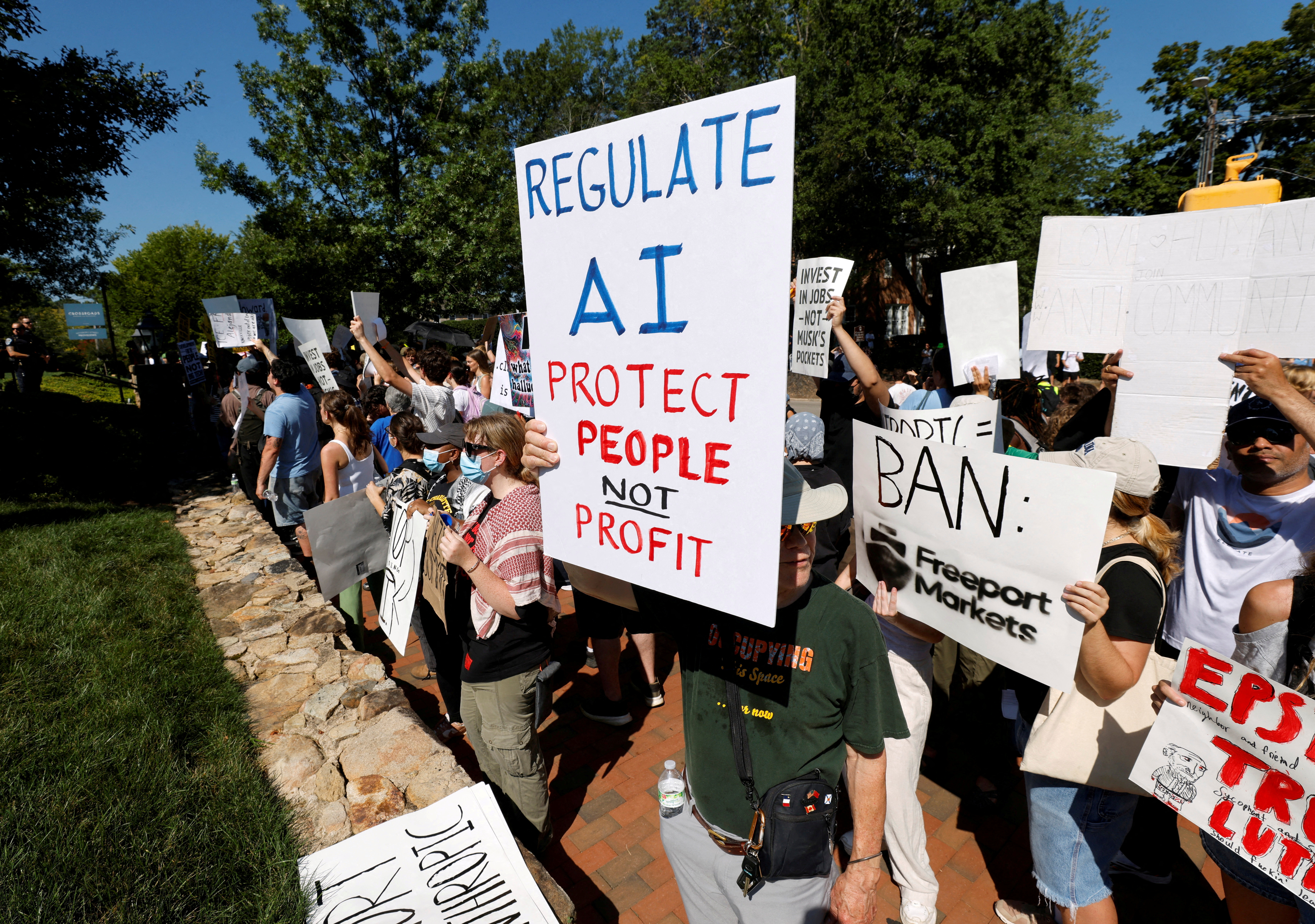 A demonstrator holds a sign calling for regulation of artificial intelligence during a protest outside the G20 Innovation Ministerial summit, in Chapel Hill, North Carolina, U.S., September 2, 2026. REUTERS/Jonathan Drake/
