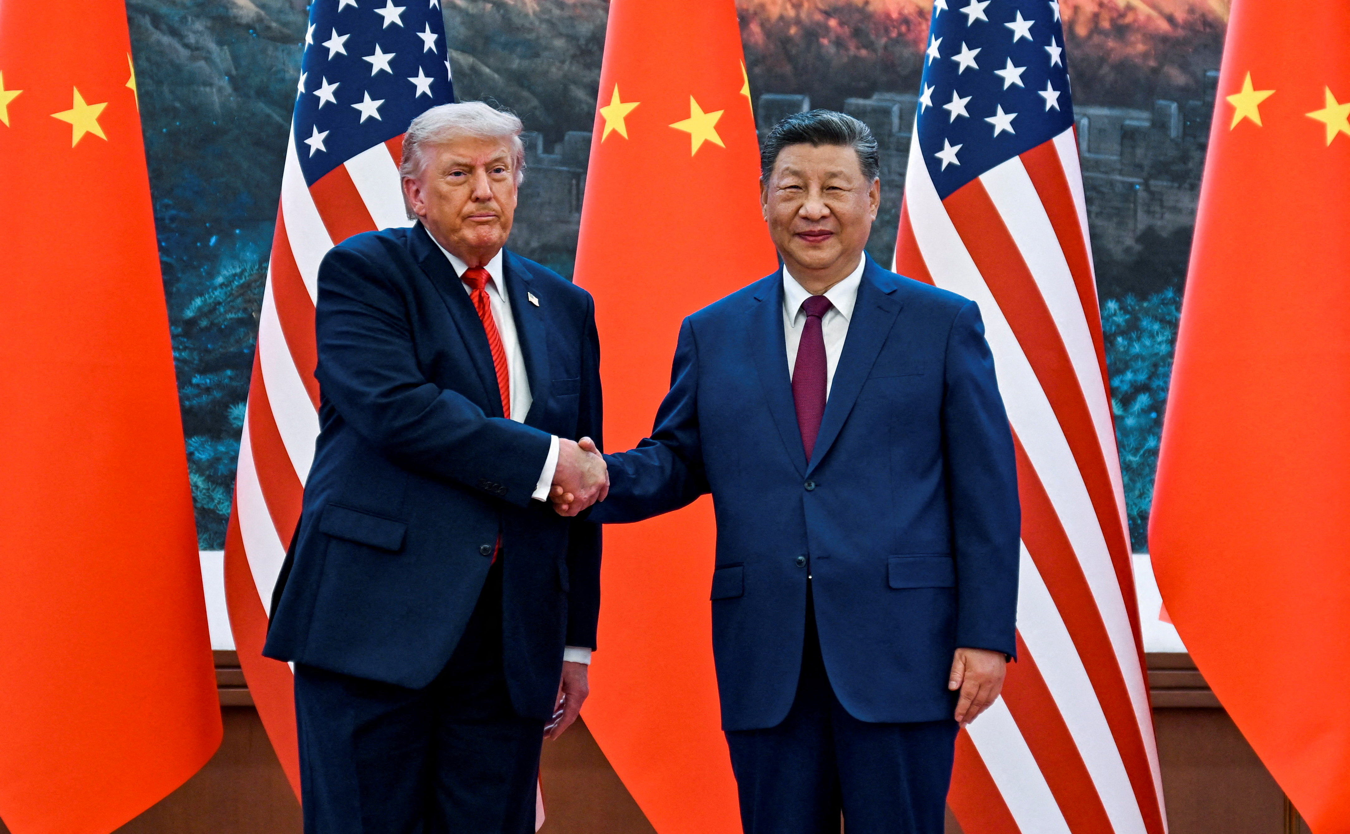 FILE PHOTO: FILE PHOTO: The scene as U.S. President Donald Trump participates in events at the Great Hall of the People and does a greeting with the President of the People’s Republic of China Xi Jinping May 14, 2026, in Beijing China during a trip focused on trade, regional security, and strengthening bilateral ties between the world’s two largest economies. Kenny Holston/Pool via REUTERS TPX IMAGES OF THE DAY/File Photo/File Photo