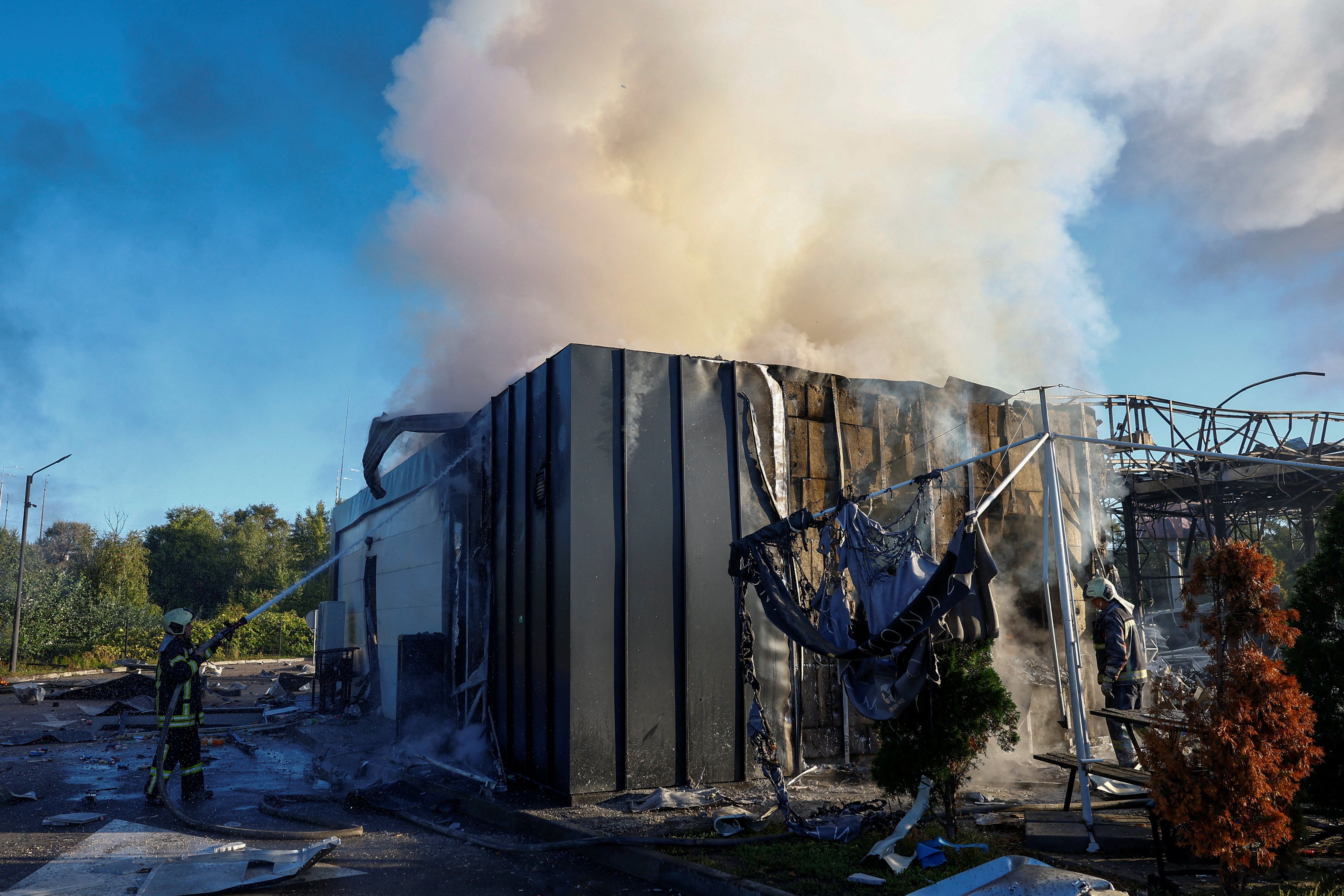 Firefighters work at the site of a petrol station hit by a morning Russian drone strike, amid Russia's attack on Ukraine, in Kyiv, Ukraine September 23, 2026. REUTERS/Valentyn Ogirenko