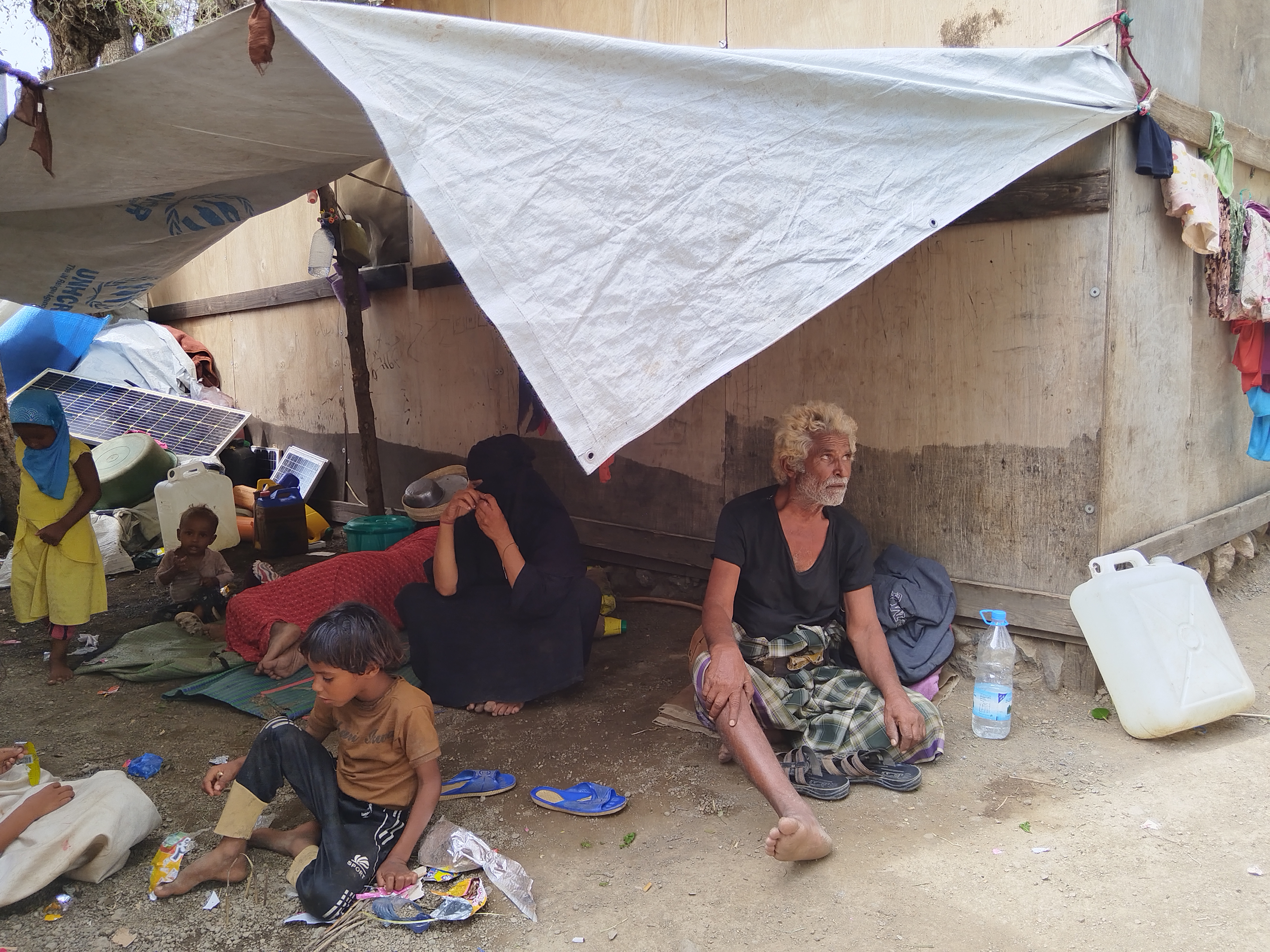 Displaced man Hajj Saif Qaed Thabet, 73, has been living in the open air since he arrived with his family at al-Munij camp on Thursday, September 10 [Al Jazeera]